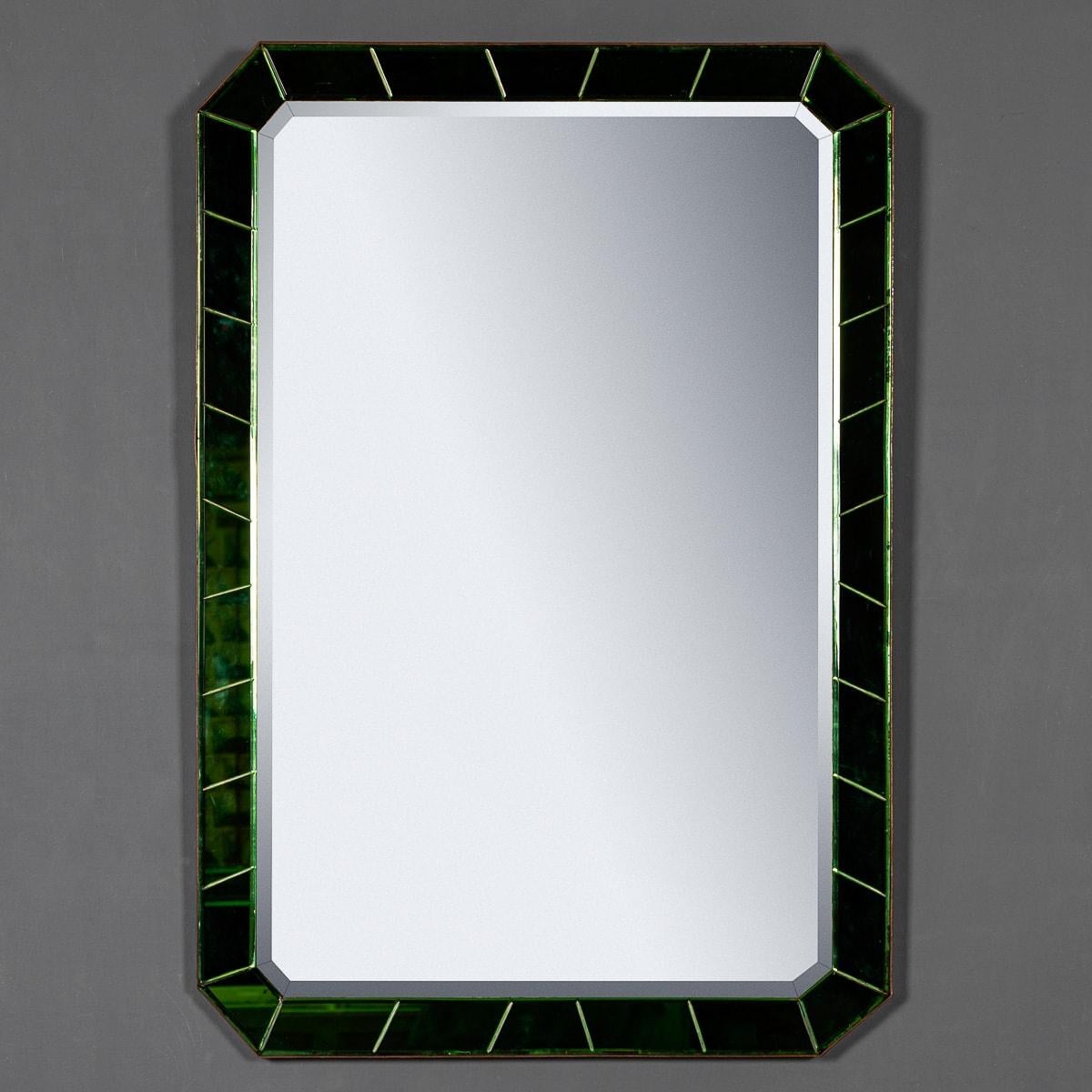 Antique early 20th Century Art Deco style mirror with a segmented green glass & brass bevelled surround. A beautiful piece of period furniture, a very practical and a truly wonderful conversation piece capable of transporting the imagination to a