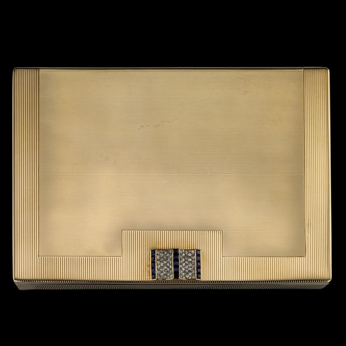 Antique 20th century Cartier Art Deco 9 carat gold extremely large compact, of rectangular form, inside bearing various open and closed compartments and a retracting lipstick, the top lid mounted with a sliding push-button, set with brilliant cut