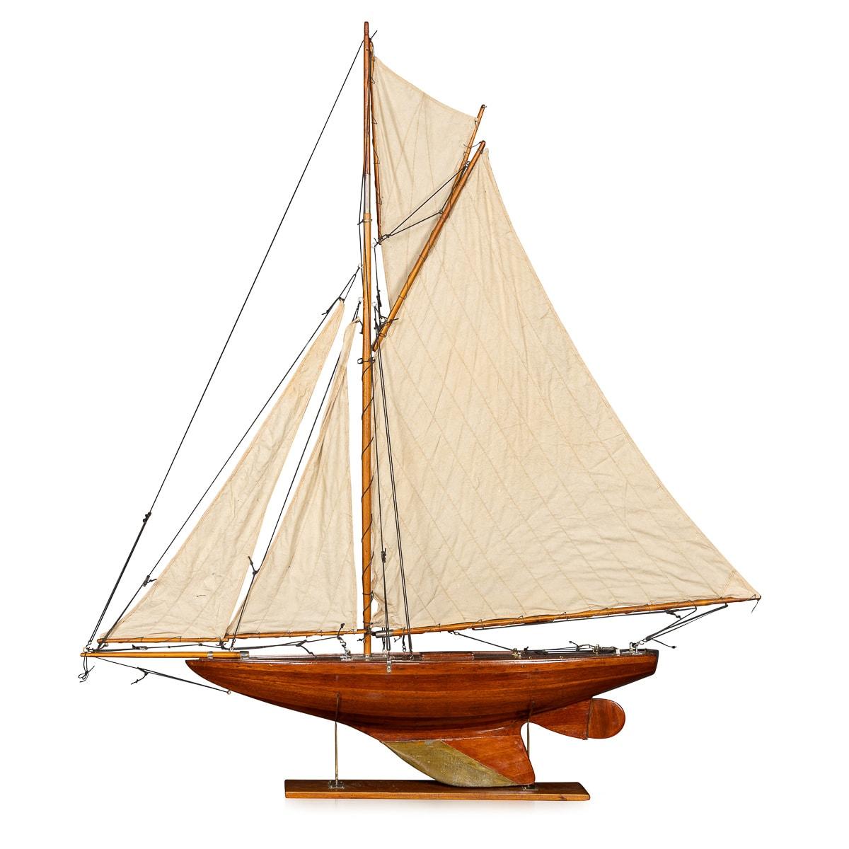 A fantastic Gaff Cutter pond yacht, lovely “bread and butter“ wood hull construction dating to the early part of the 20th Century. This particular pond yacht features original calico sails, rigged with chrome fittings and also a weighted keel,