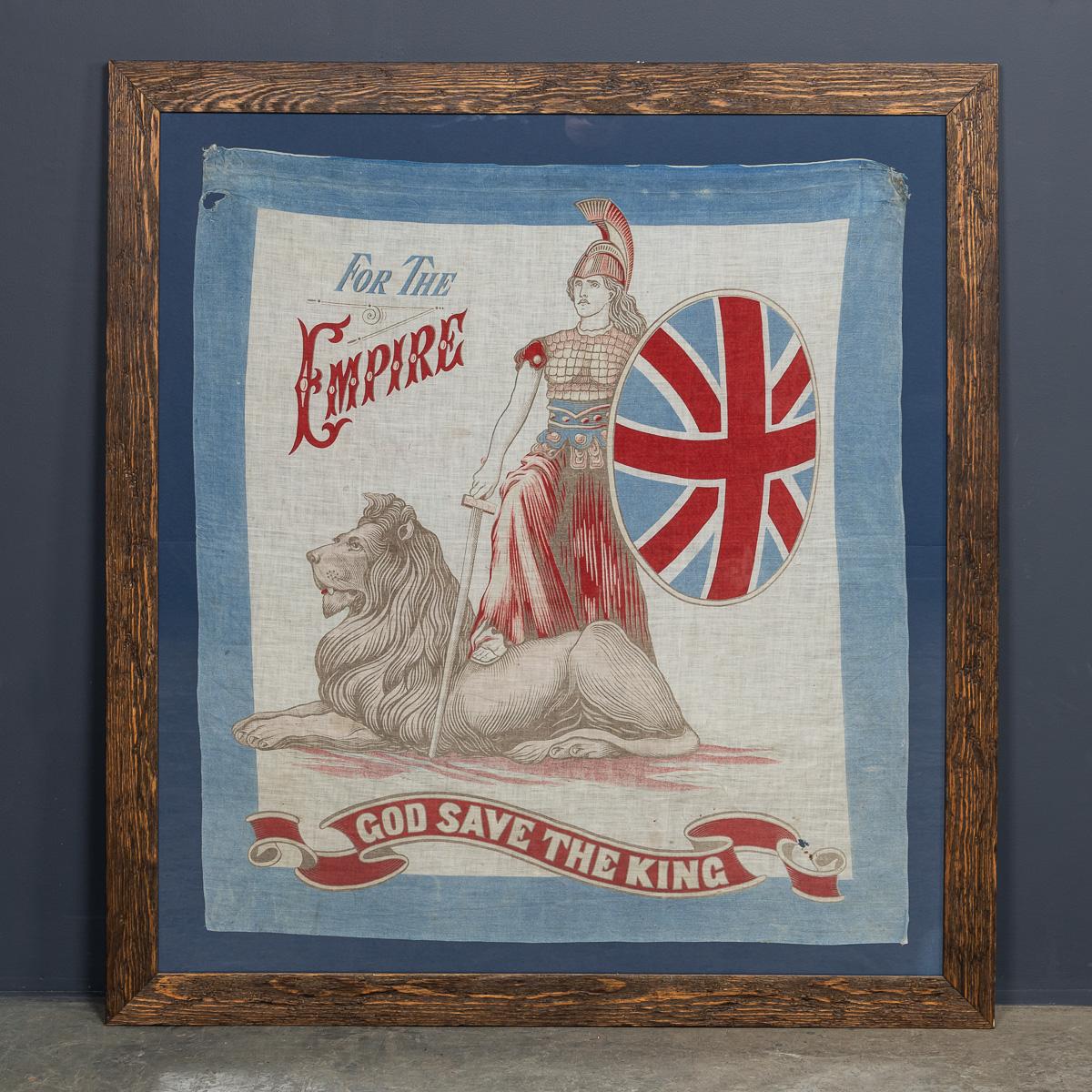 Un excellent drapeau édouardien du 20e siècle, encadré dans du bois récupéré, représente Britannia aux côtés de son lion. Elle tient une épée et un grand bouclier incurvé portant le drapeau de l'Union, dont la forme symbolise la vaste étendue de