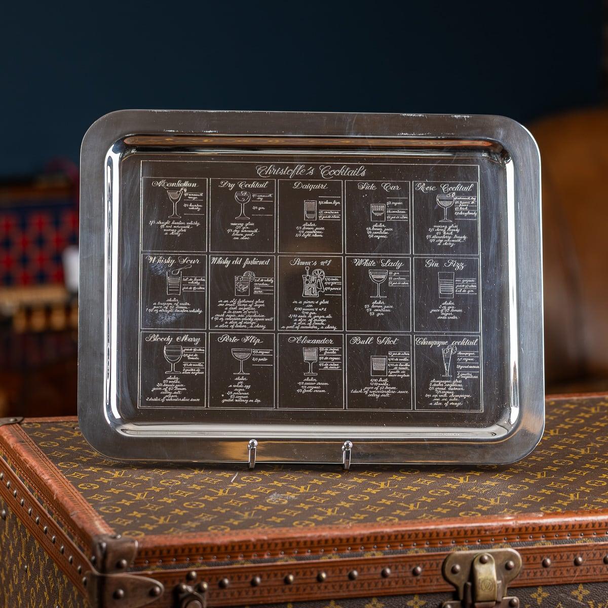 Antique early 20th Century French silver plated highly useful, desirable and collectable piece of barware for the cocktail enthusiast. The tray is finely engraved with fifteen cocktail recipes including a Manhattan, Whisky Sour, Gin Fizz and a