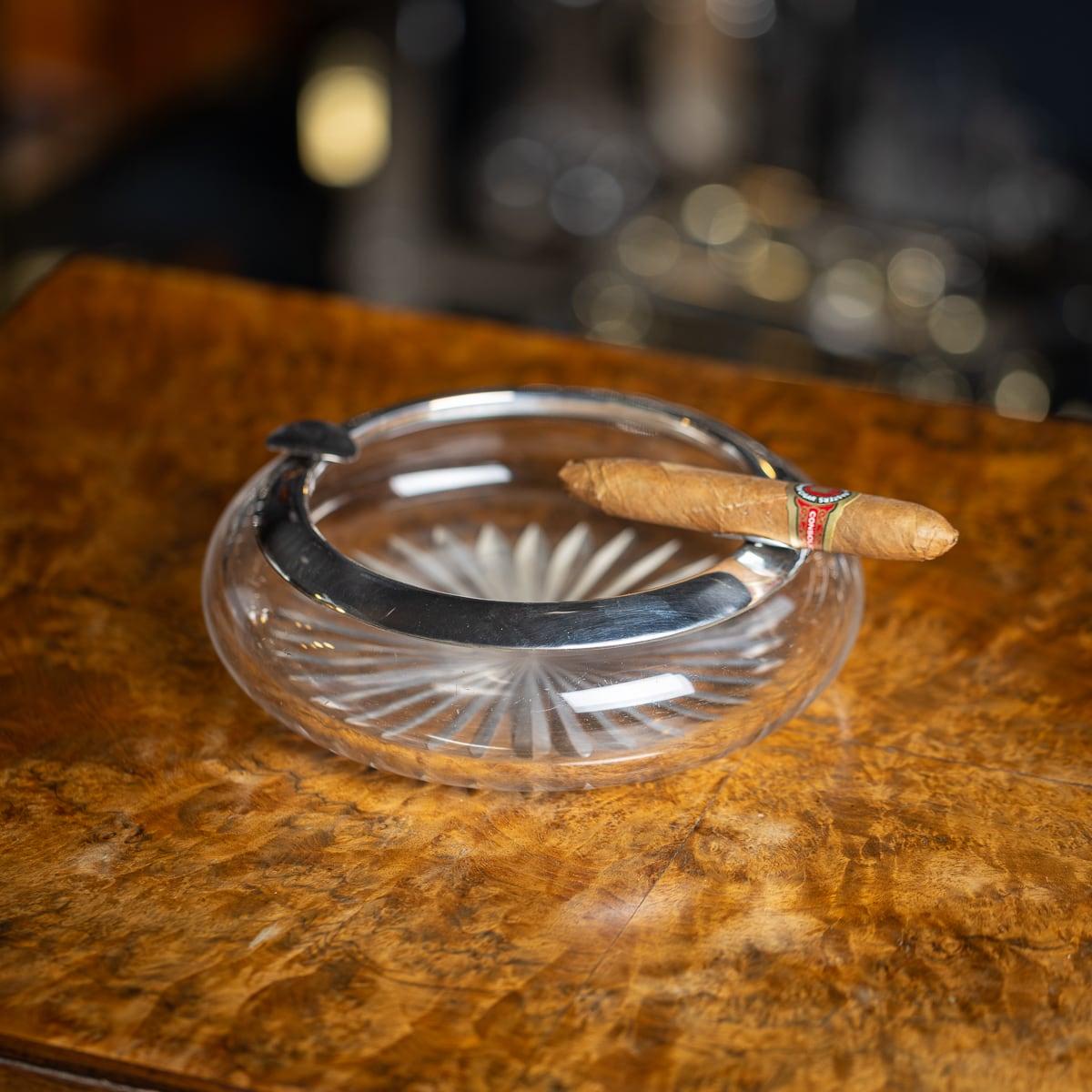 Antique early 20th Century German solid silver & cut glass mounted ashtray. The plain rim applied with two cigar rests. It is easy to imagine the appeal behind these objects which would have made wonderful items to wow their guests. As relevant