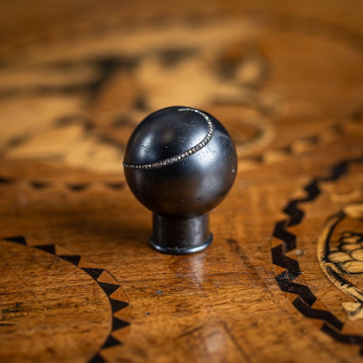Antique early-20th Century Imperial Russian gun metal cane handle, mounted with approximately 100 small old cut diamonds which spiral around the cane handle.The diamonds turn a simple ball shaped walking stick handle into something