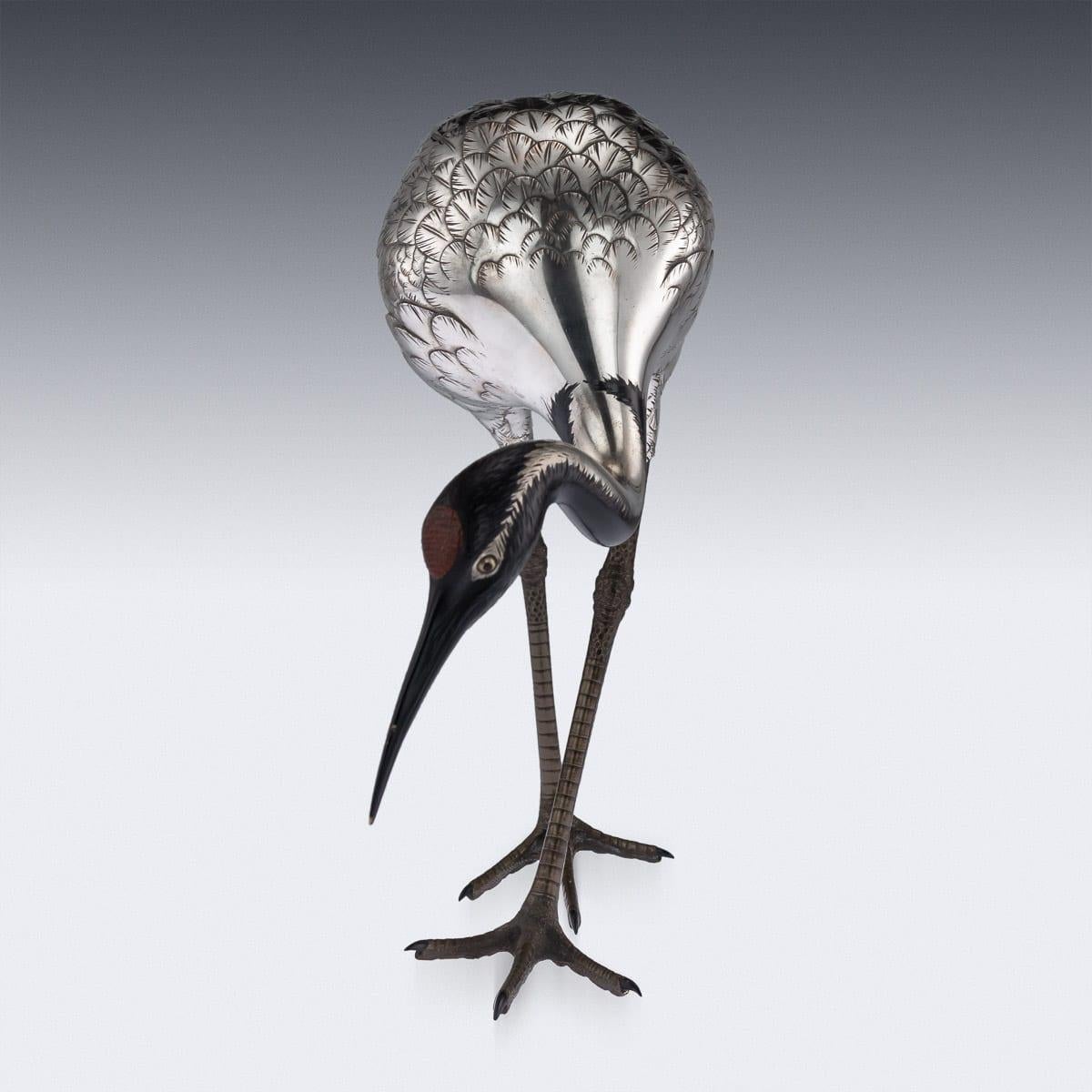 Antique early 20th century Japanese Meiji period very fine silvered figure of a egret. The naturalistically modeled bird with gold set eyes, with realistic engraved feathers, applied with niello decoration to the head and back. Apparently