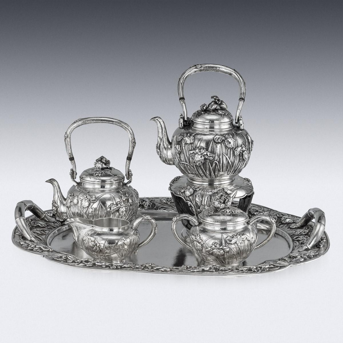 Antique early 20th century Japanese Meiji period solid silver four-piece tea service on tray, consisting of a tea kettle on stand, teapot, covered sugar bowl, cream jug and tray, exceptional and magnificent quality, double walled, embossed and