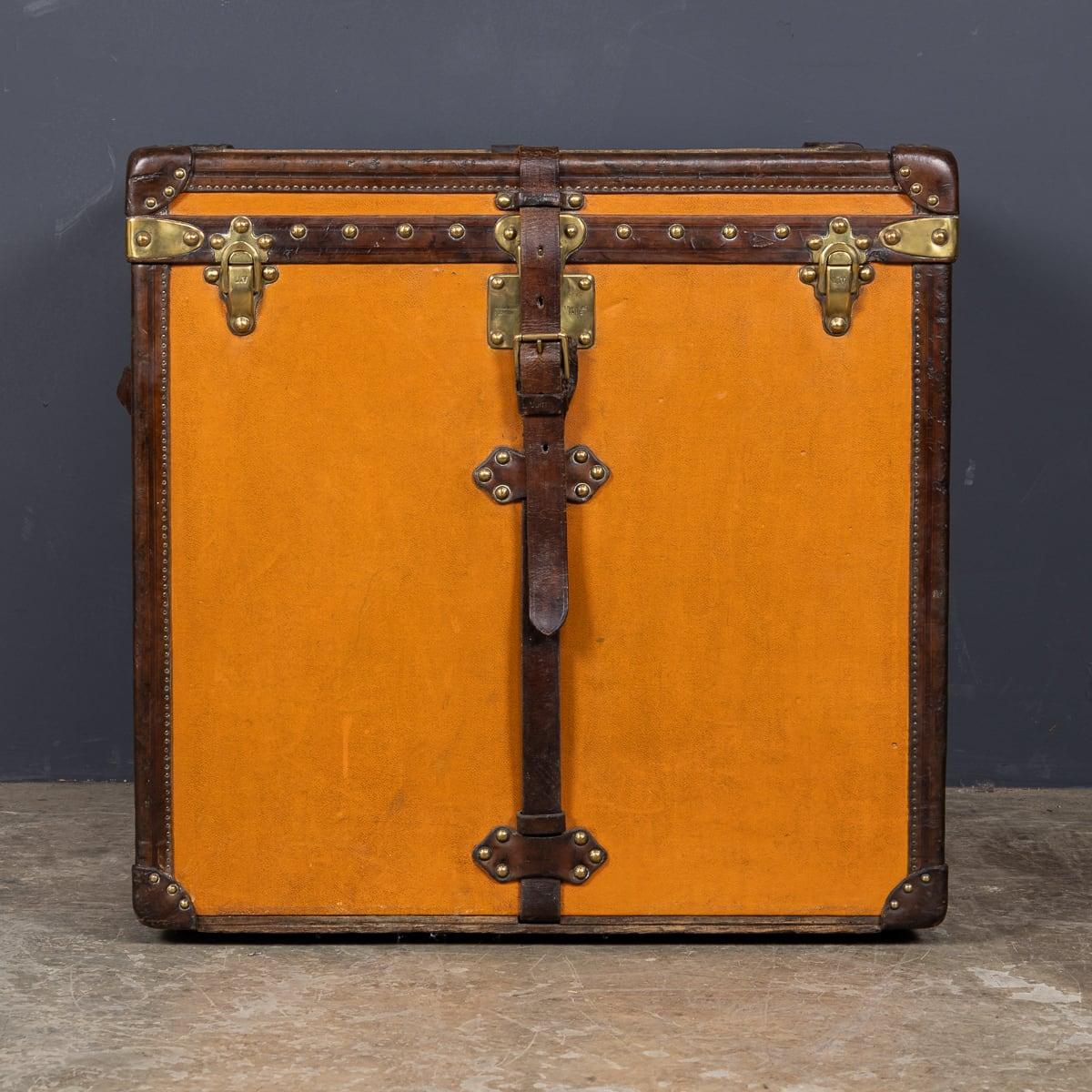 A very rare 20th Century Louis Vuitton hat trunk, circa 1910, featuring orange “Vuittonite“ canvas, all brass hardware, and leather trims. It is rare to find these trunks in as good condition as this one. Trunks in this type of finish are rarer than
