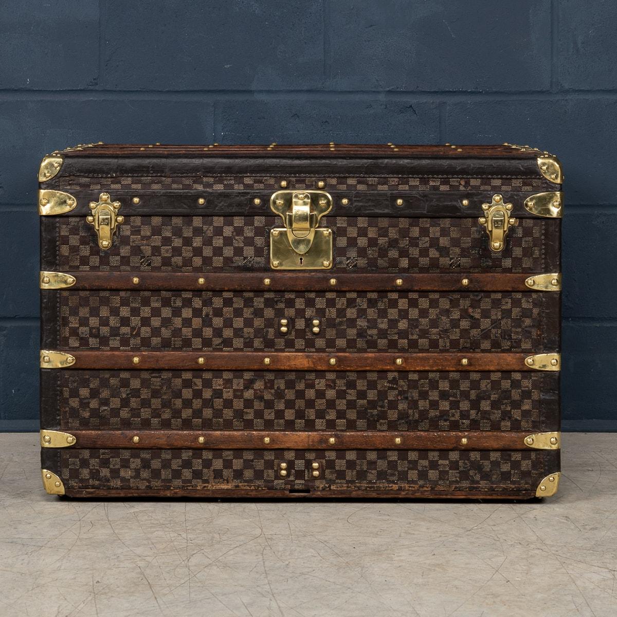 One of the rarest Louis Vuitton trunks to be offered, this trunk is covered in the world famous damier (checkerboard) canvas. Dating to around 1900, it is a wonderful example of such trunks. With its leather trim, brass studs, fittings and locks it