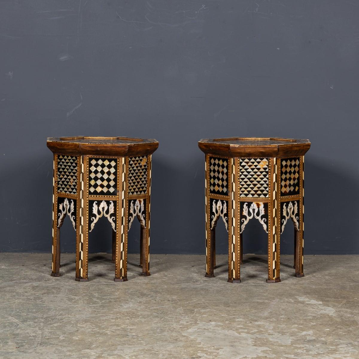 Antique 20th Century pair of levantine inlaid tables from the 1920's. Handmade in hardwood in an octagonal shape, with intricate inlaid patterns covering all sides. A rich patina of age adds to the beauty of this pair. Levantine tables capture the