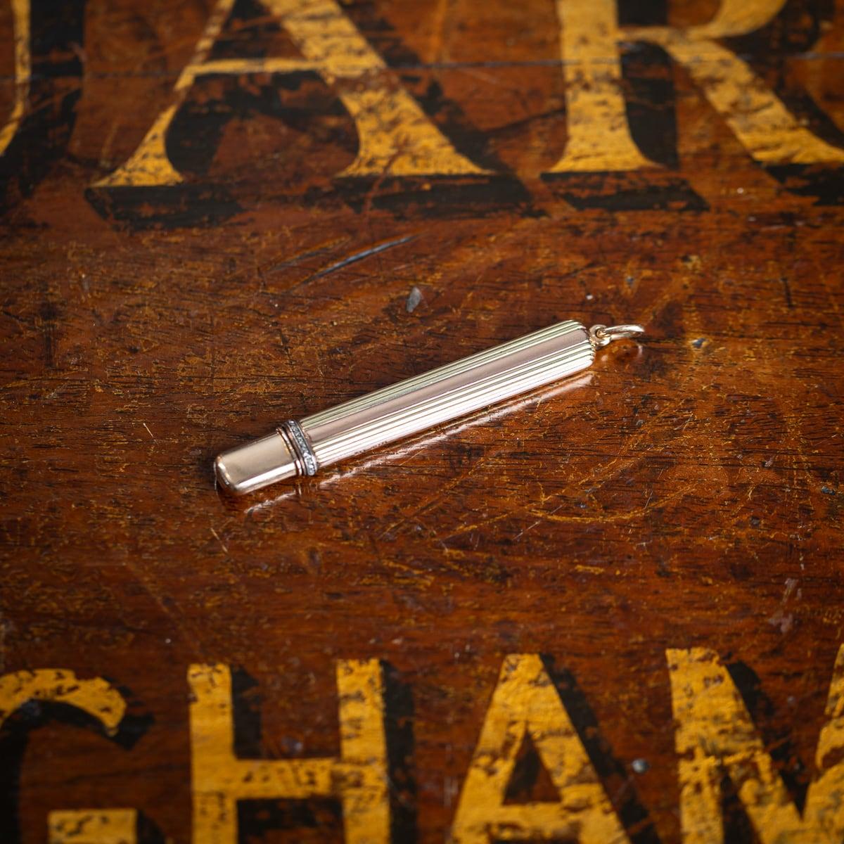 Antique early-20th Century Imperial Russian two-colour gold & diamond pencil holder, of flattened rectangular form, reeded in two colour gold and mounted with old cut diamonds, made in a Faberge manner. Pencil and holder hallmarked Russian gold 56