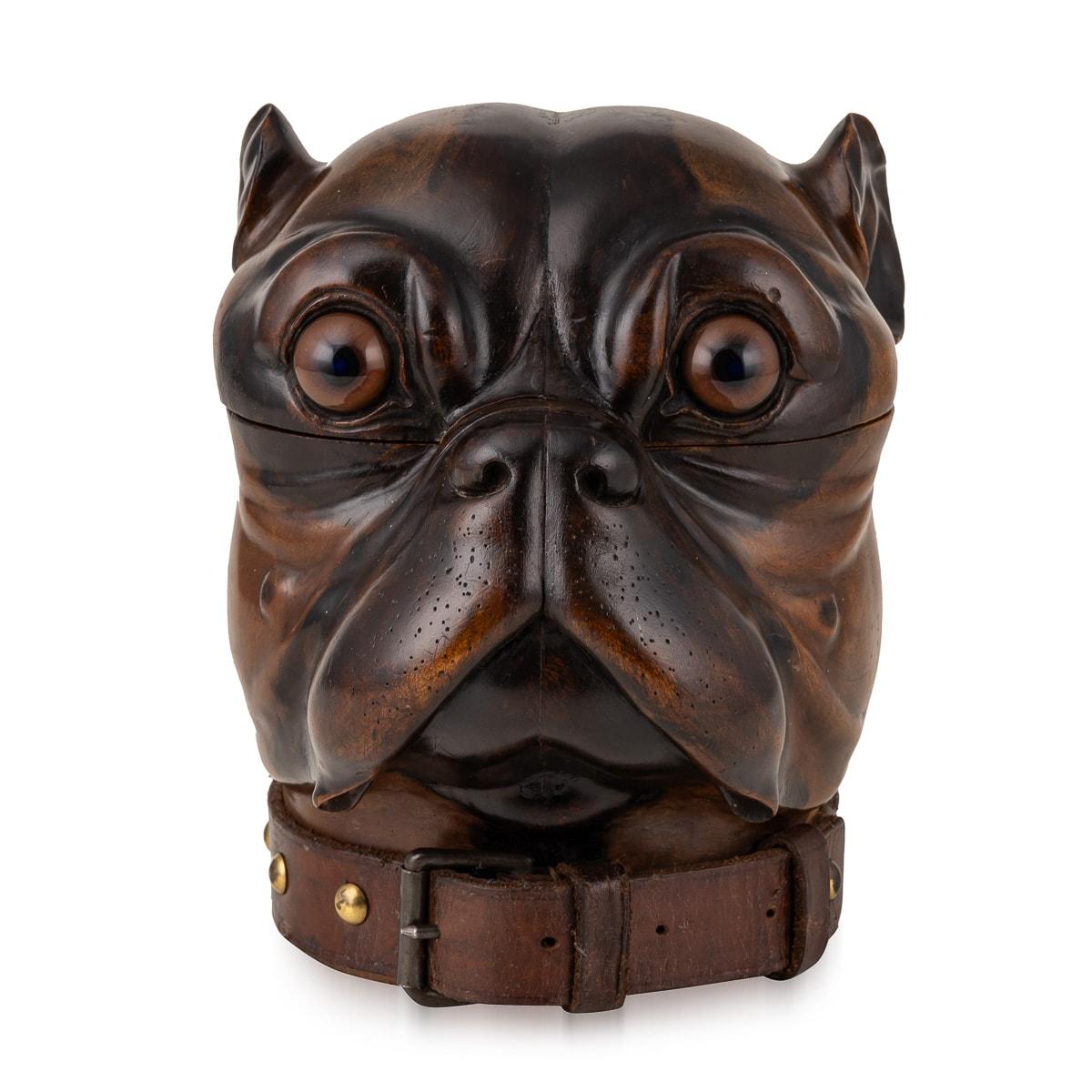 Antique 19th Century Victorian lignum vitae tobacco jar carved in the form of a bulldog head. The detail is of exceptional quality, featuring glass eyes and a leather collar around the base. A truly wonderful piece and a must desk accessory for a