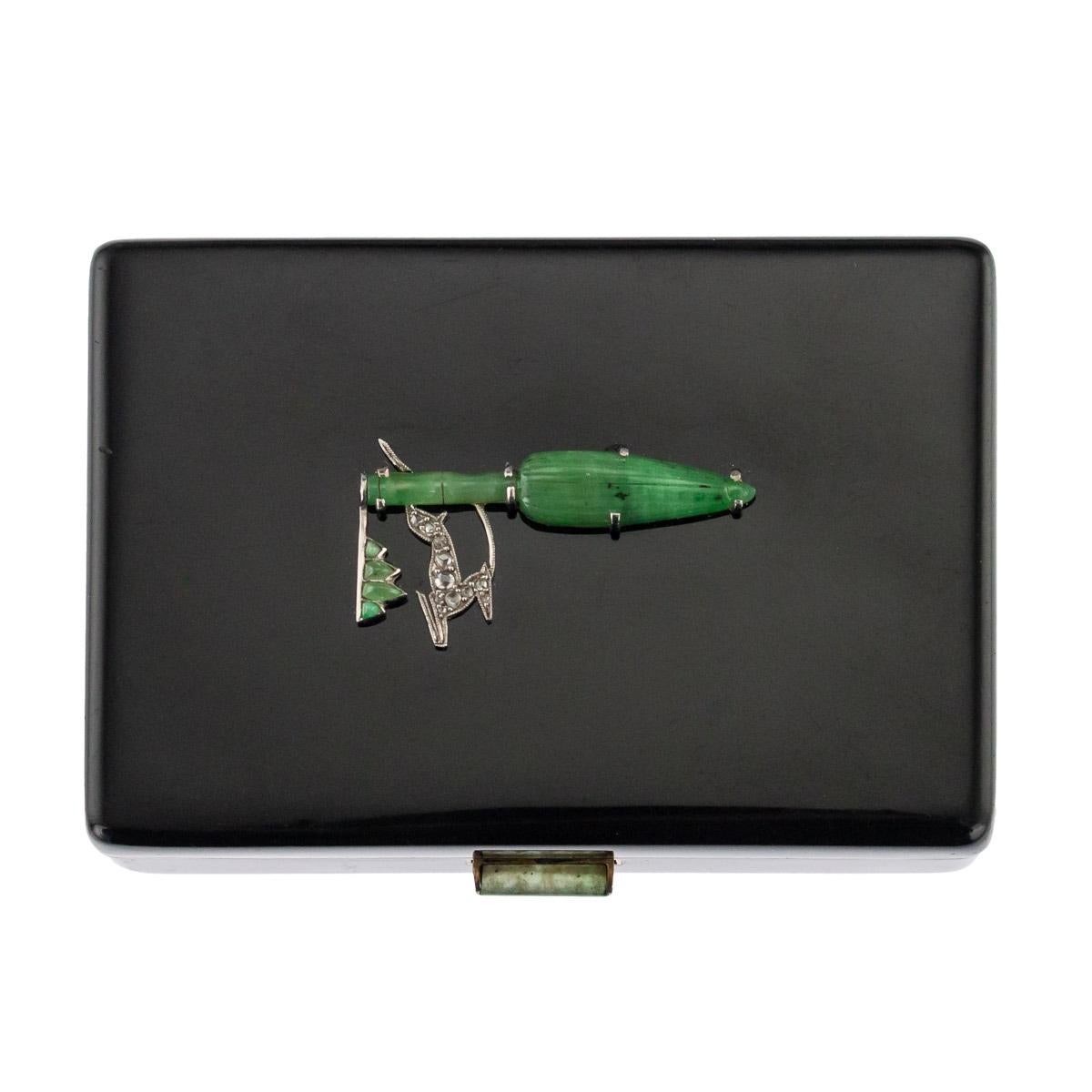 Antique early-20th century French Art Deco 18-karat gold vanity case, of rectangular form with rounded corners, the lid set with a bamboo leaf shaped jade plaque of Chinese inspiration, gazelle in platinum, set with eight old cut diamonds, the whole