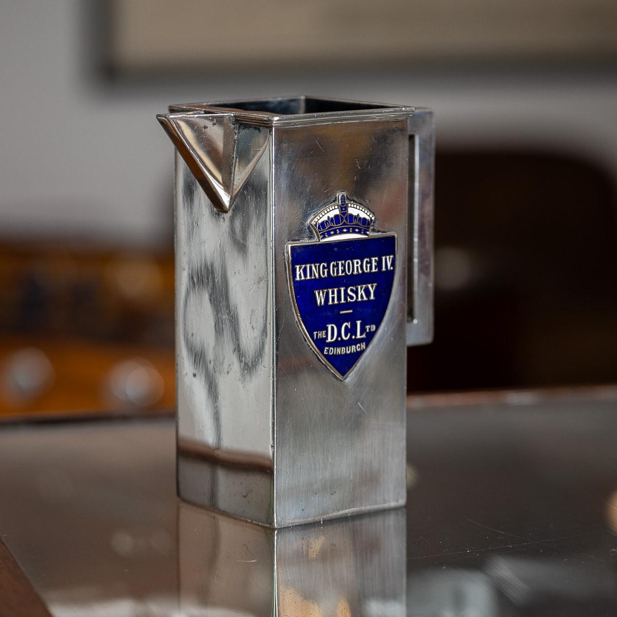 Antique 20th Century Art Deco large silver plated water jug. Crafted in a unique rectangular shape with clean, straight lines throughout, this jug features an open top, perfect for adding ice to keep drinks cool. Both sides of the jug are adorned