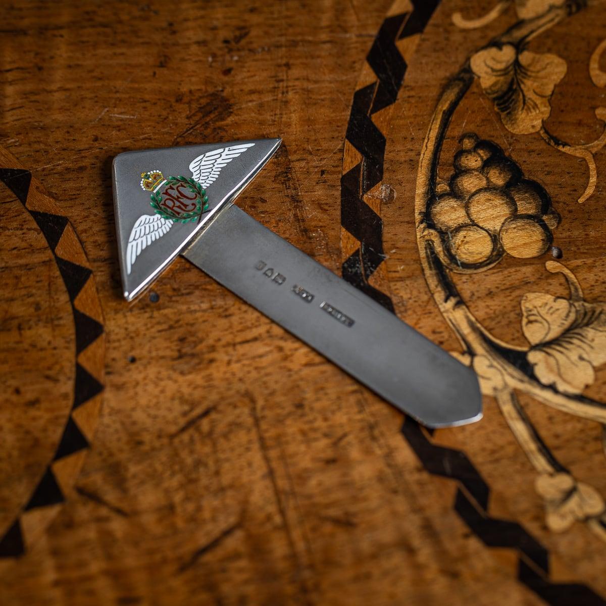 Antique 20th Century British solid silver bookmark. The bookmark is in the shape of an arrow with an enamelled pilots wings 