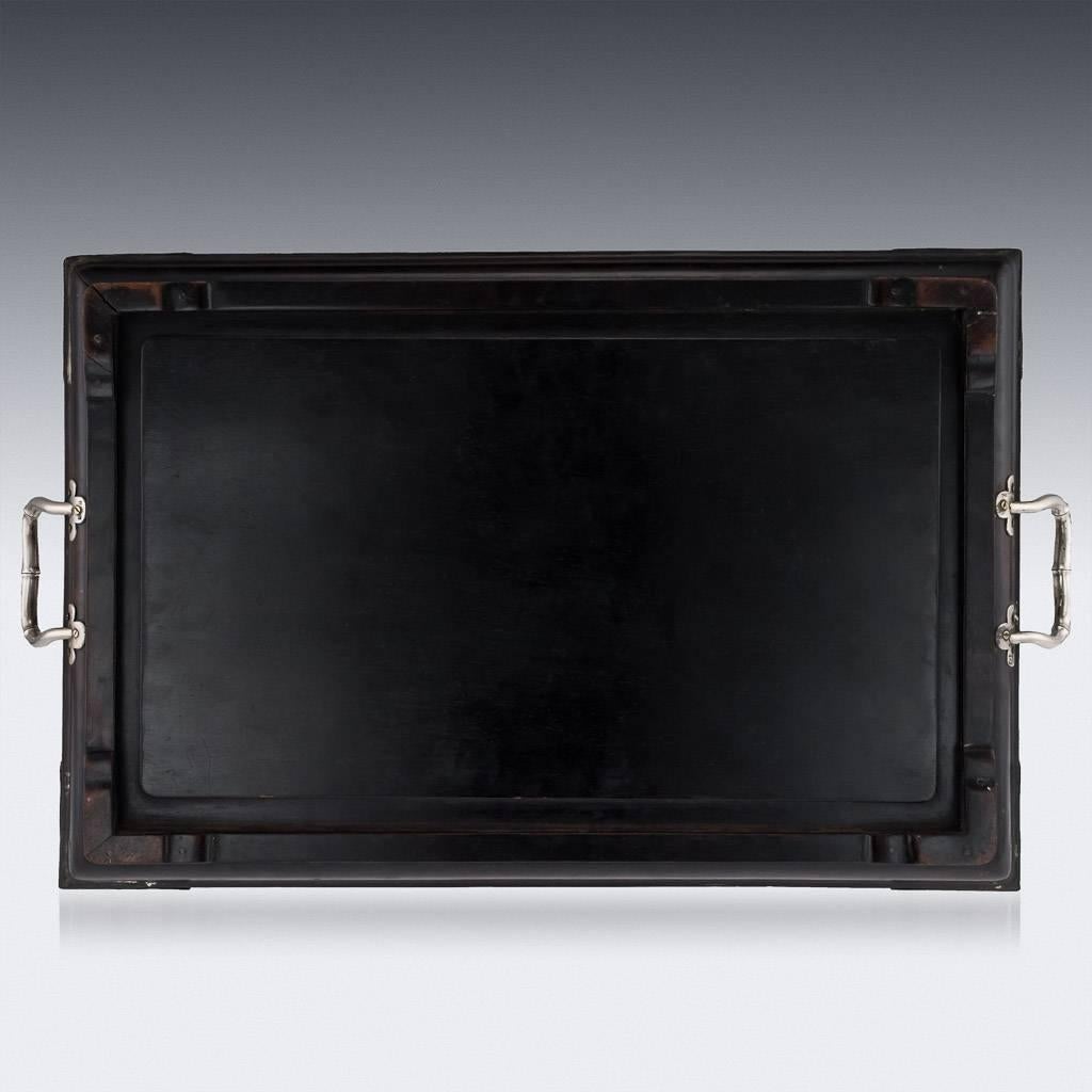Antique early-20th century Chinese export solid silver mounted large rosewood serving tray, of rectangular form, the corner are applied with silver corners beautifully hammered, the surface is inlaid with silver depicting a bamboo branch with leaves