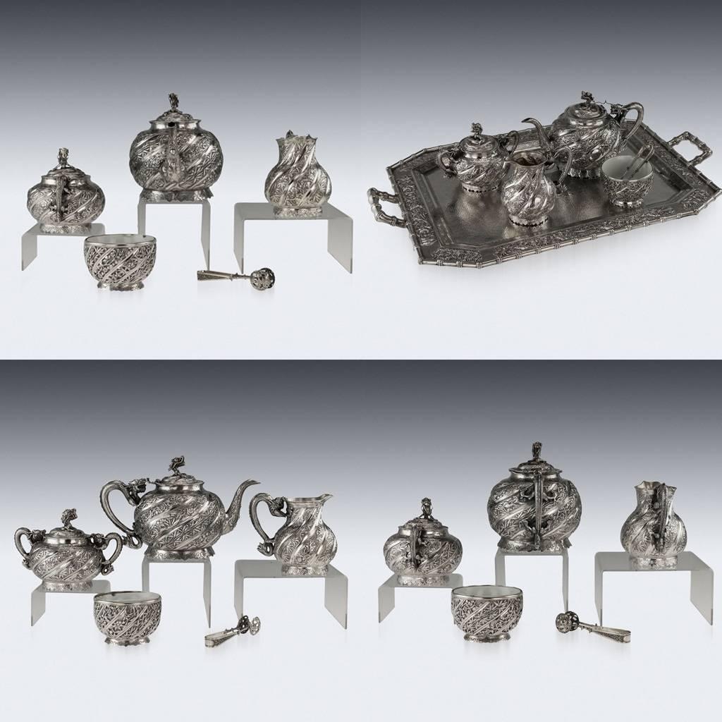 Antique early 20th century Chinese Export solid silver five piece tea set on tray, comprising of teapot, sugar bowl, milk jug, waist bowl, sugar tongs and tray. Each spherical body is beautifully hammered surface decorated with bamboo leaves and