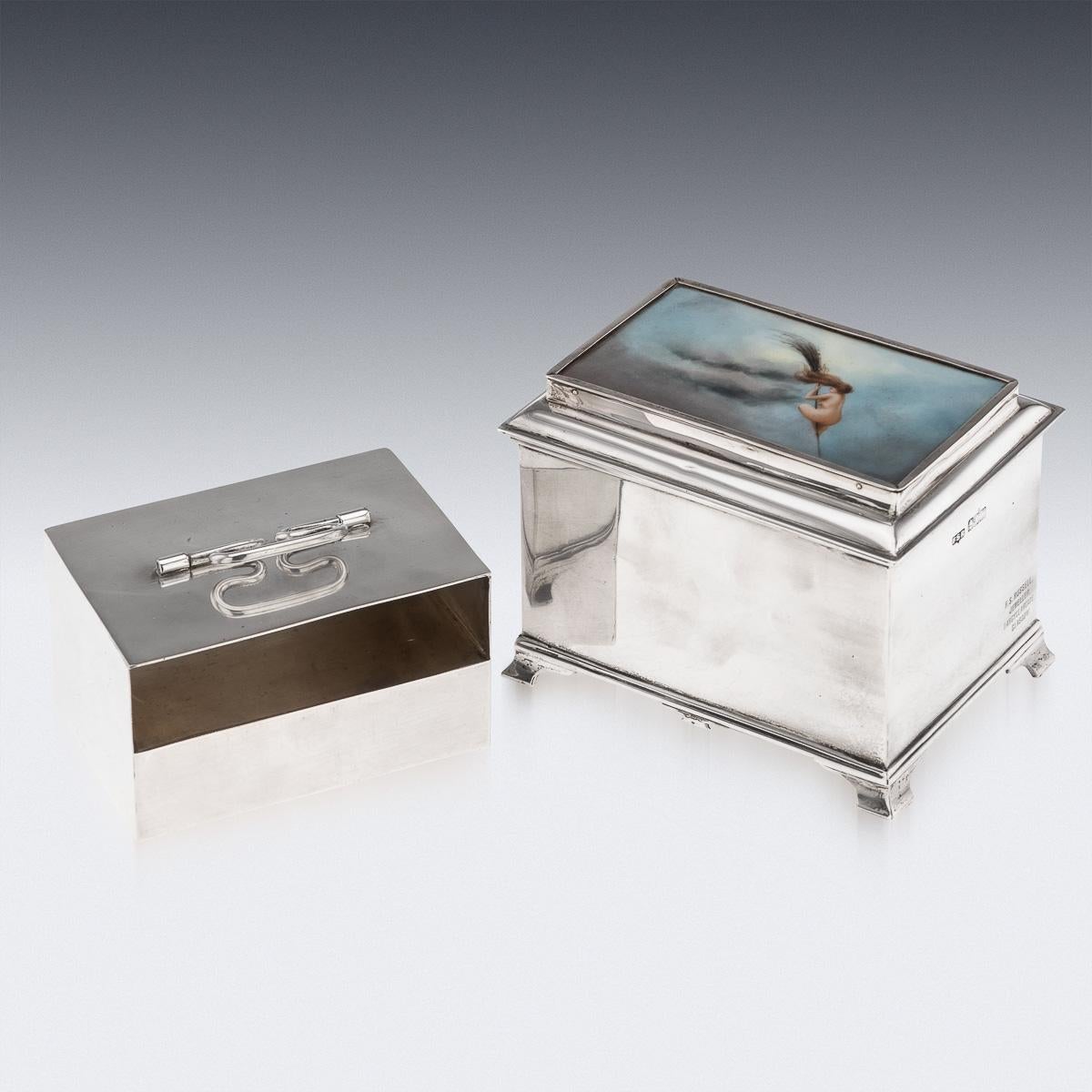 Antique early 20th Century Edwardian solid silver cigarette box with a removable double sided cigarette holder. The lid is set with a porcelain plaque depicting a very unusual erotic scene of a nude witch riding a broomstick, against a sky