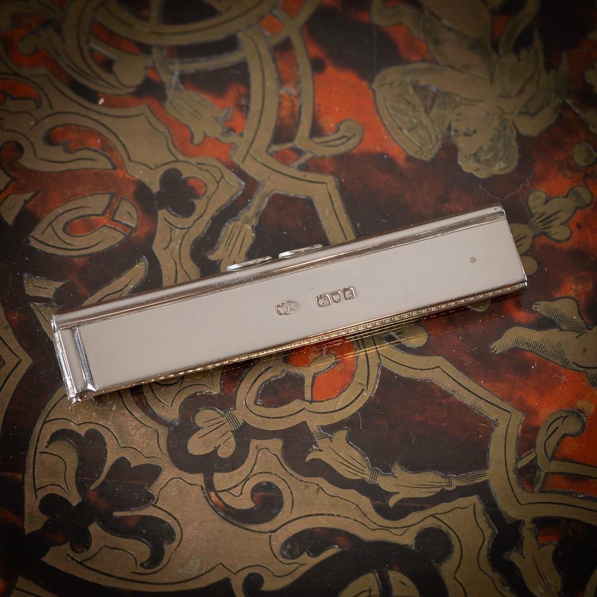 Antique 20th Century Edwardian solid silver combination pen, pencil, and ruler, crafted as a compact, foldable pocket or desk accessory. The ruler flips out to provide six inches of measurements, while two side thumbpieces allow either the pen or