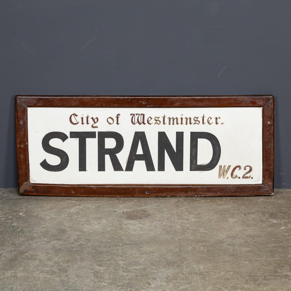 Antique 20th Century framed enamelled London street sign, created for Strand, WC2 (Central London, Westminster). This sign showcases the iconic colouring and font. A fantastic item and a notable piece of history.

CONDITION
In Great Condition - Wear