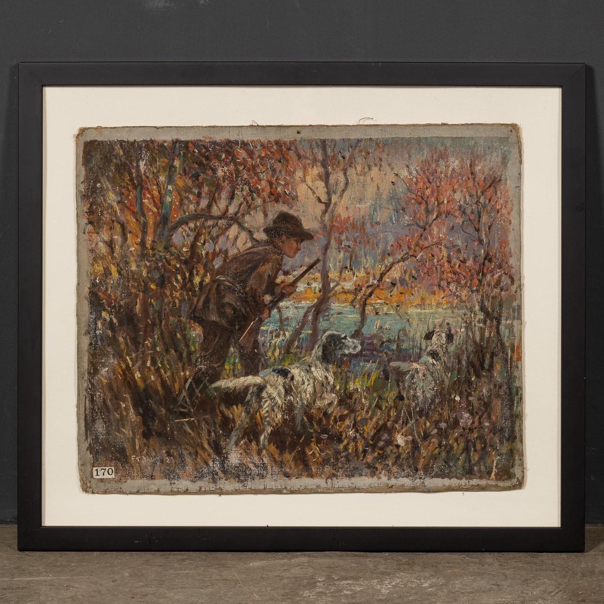 An antique 20th Century oil on canvas piece by Frederick Thomas Daws portraying a hunting scene. In the painting, a gentleman is seen holding his shotgun alongside his pair of hunting dogs, crouching in the woodland. Daws, famed for his depictions