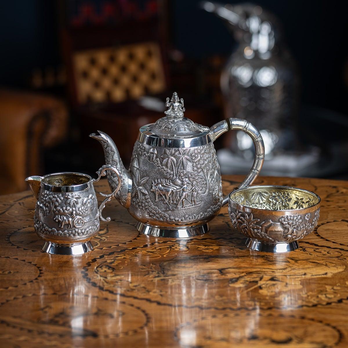 Antique early 20th Century Indian solid silver three piece tea set. Repoussé decorated in relief with figures, floral patterns, villages in a landscape and farming life, this type of decoration is typically from Calcutta, more precisesly from