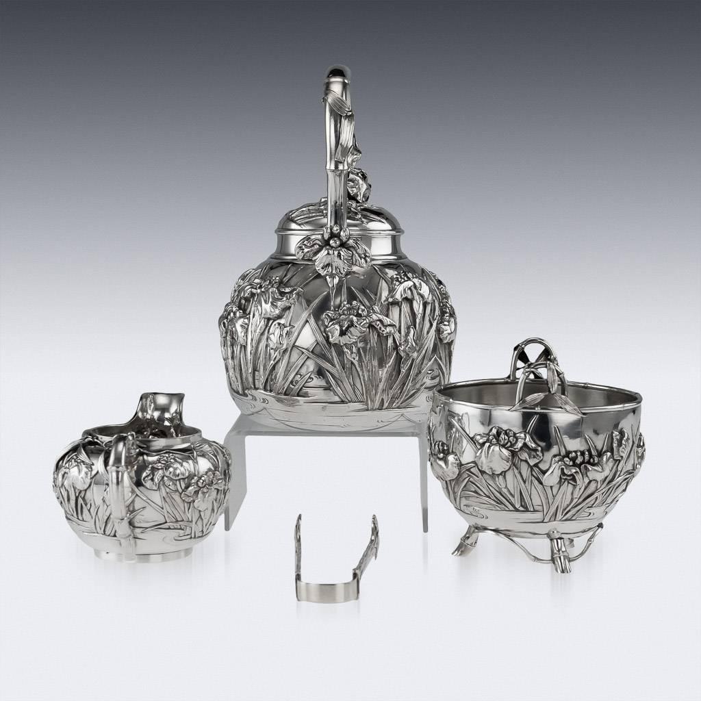 Description
Antique early-20th century Japanese solid silver four piece tea set, exceptional quality, double walled, embossed with Iris flowers in water in high relief and body applies with bamboo leaves, C-form handles and lids applied with
