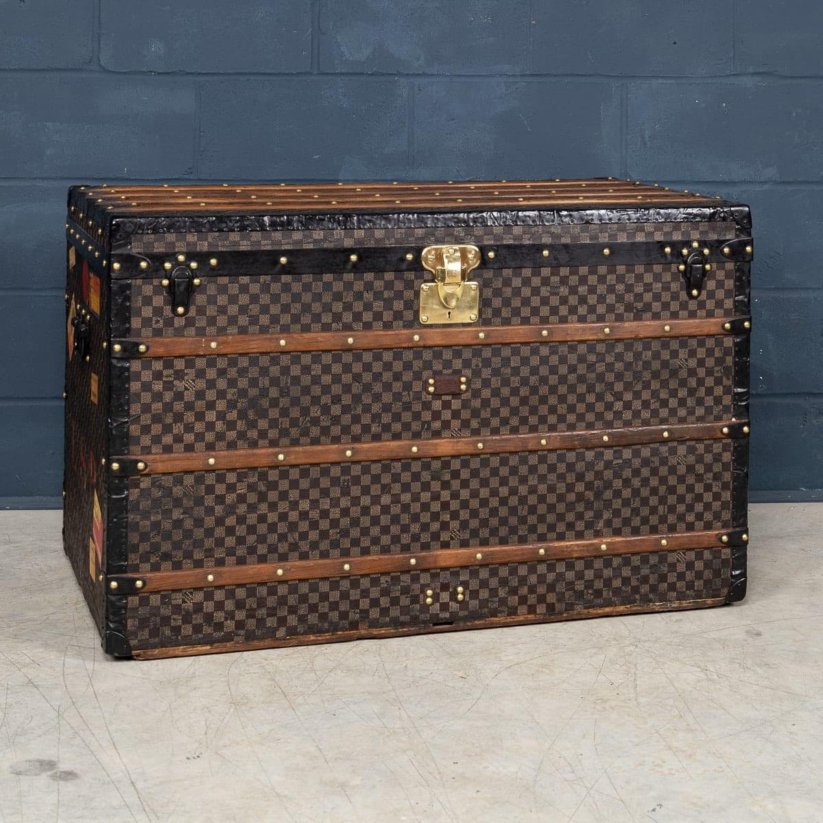 A Damier “malle haute“ (tall trunk) by Louis Vuitton, early 20th century. This trunk was the must have item of any elite traveller. Covered in the world famous LV Damier (or checkerboard) canvas, it oozes style and elegance. A fantastic conversation