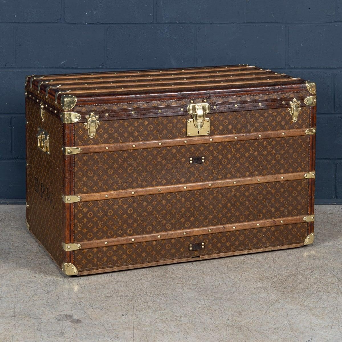 An exquisite “malle haute“ (tall trunk) by Louis Vuitton, early 20th century. The malle haute is the largest of the standard sizes, any trunk larger than this one would have been custom made. Covered in the world famous LV monogrammed canvas, with