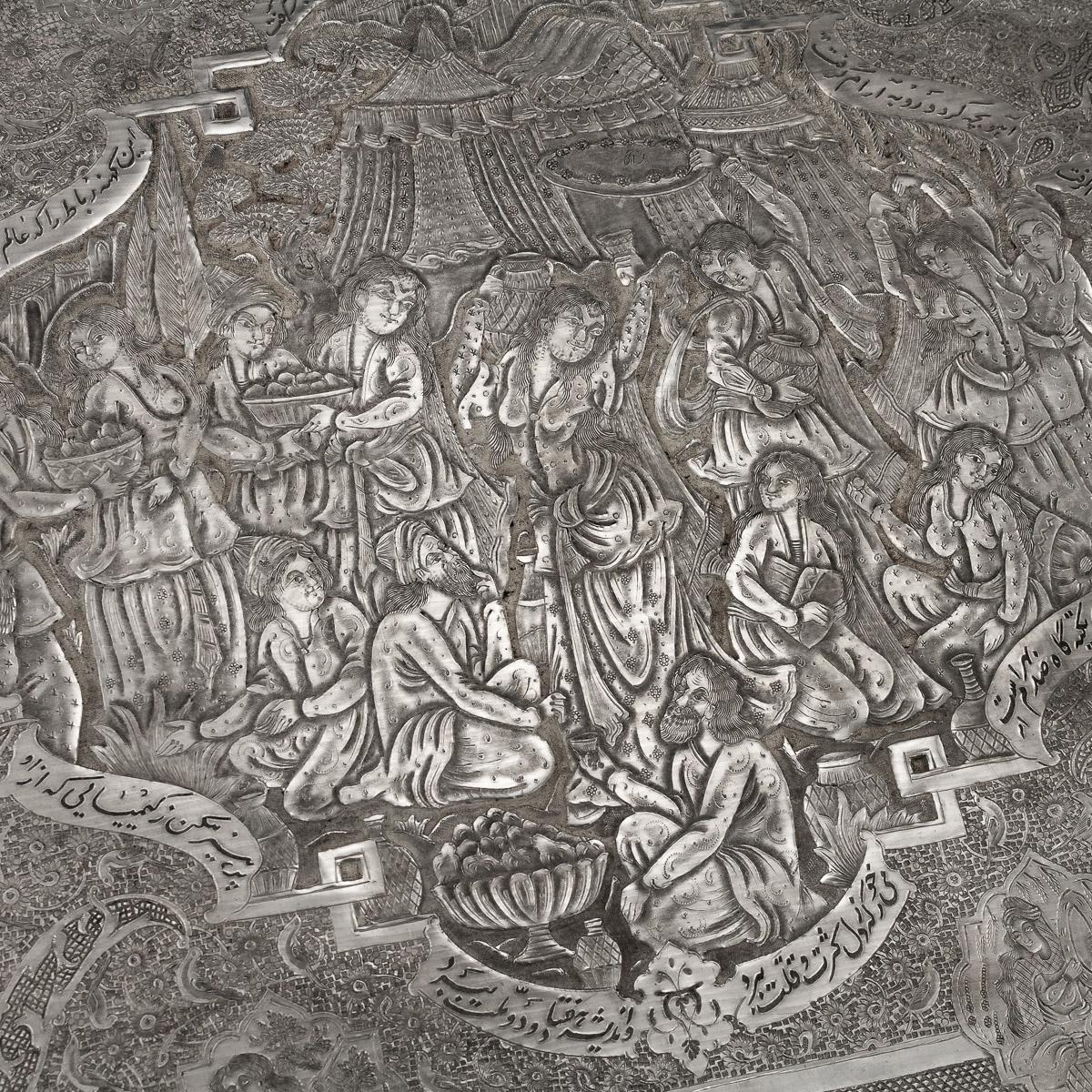 Antique 20th century Persian wall plaque or tray, of rectangular form with rounded corners, profusely repousse' decorated with various scenes depicting Persian nobility surrounded by scrolling foliage and stylized flowers, the border is also chased
