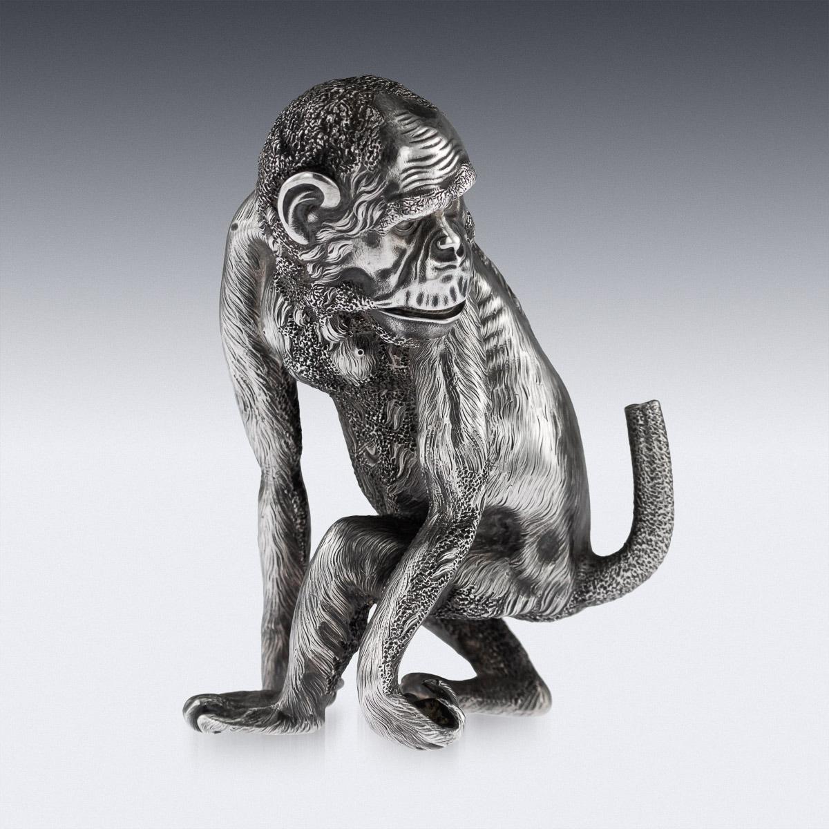 Antique early 20th century Imperial Russian solid silver cigar lighter, realistically cast and chased as a chimpanzee looking over his shoulder at his tail. Hallmarked Russian silver 88 (915 standard), St-Petersburg, 1896-1908, Fabergé in Cyrillic
