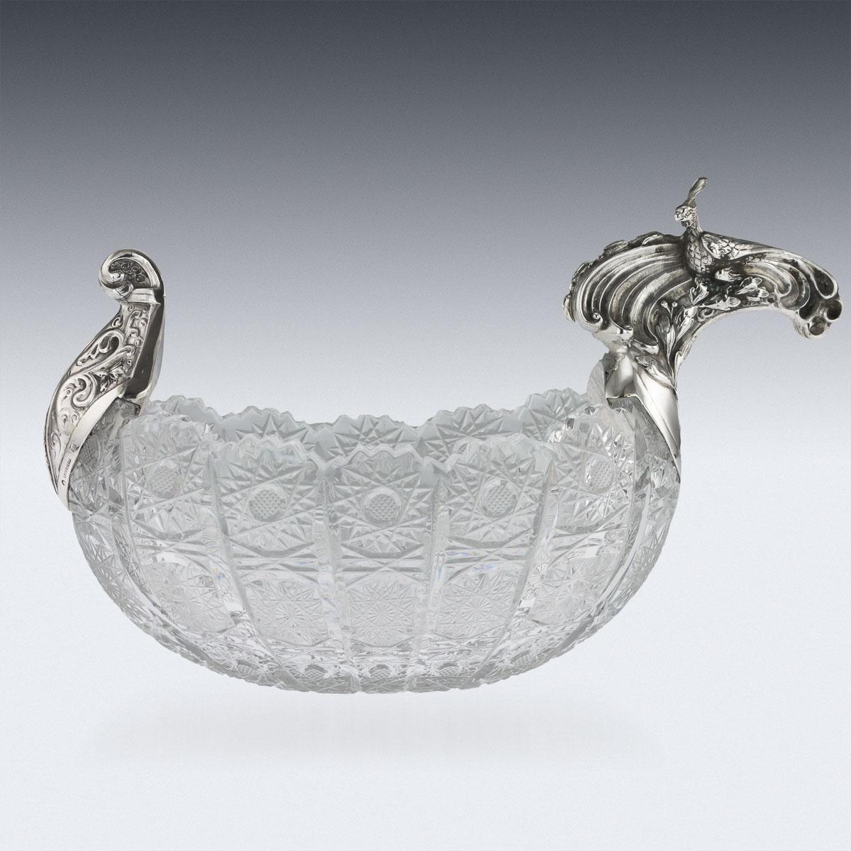 Antique early-20th century Imperial Russian solid silver & cut-glass Pan-Slavic style kovsh. with a curling mount prow, the handle cast and chased depicting a Firebird from the fable by Alexander Sergaiavich Pushkin, the body cut with a diamond and