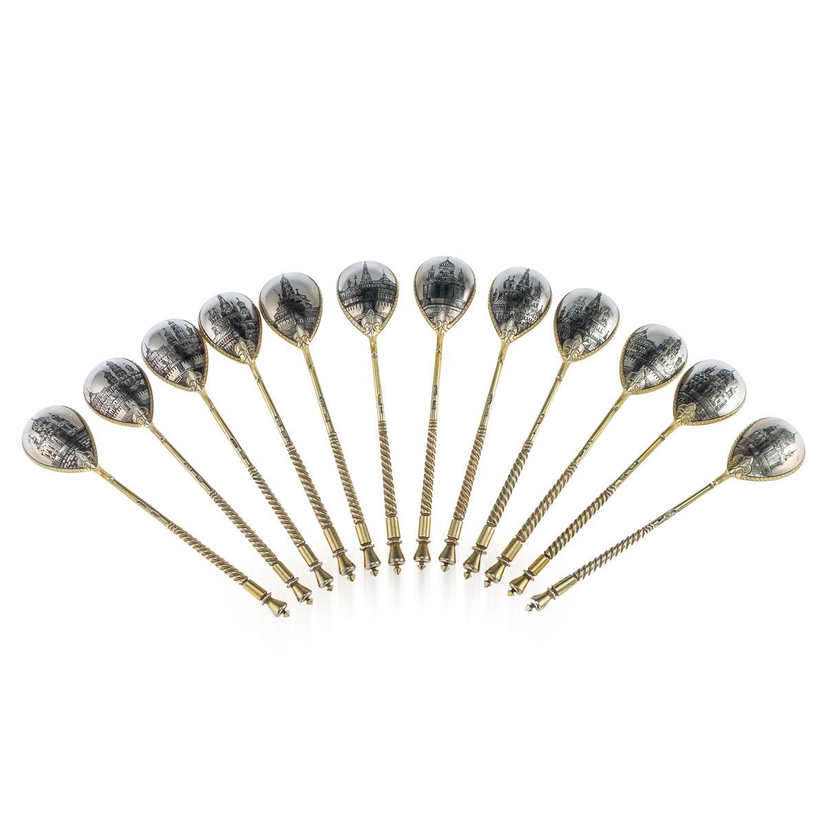 Antique 20th century imperial Russian solid silver-gilt & niello enamel set of 12 tea spoons, the backs of the spoons bowls with views of Moscow churches in niello, with twist handles and mitre finials. All pieces are Hallmarked Russian Silver (84),