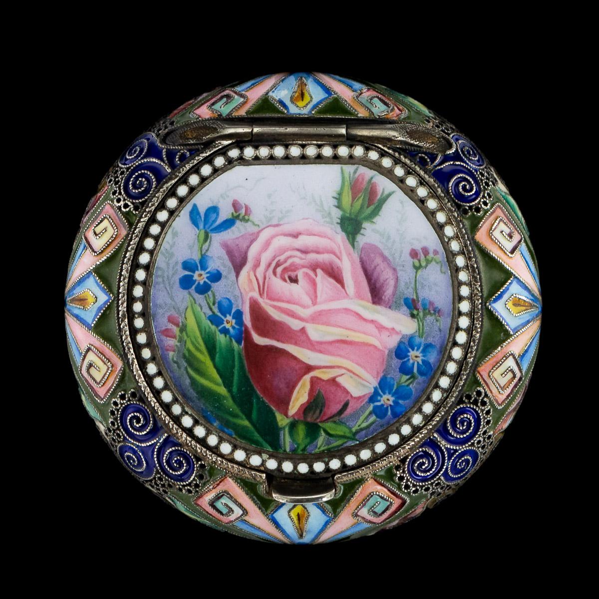 Antique early 20th century Imperial Russian solid silver and hand painted enamel, cushion shaped pill box, all side decorated with traditional Russian stylised flowers, foliage, geometric designs in polychrome cloisonne' enamel, the lid is hand