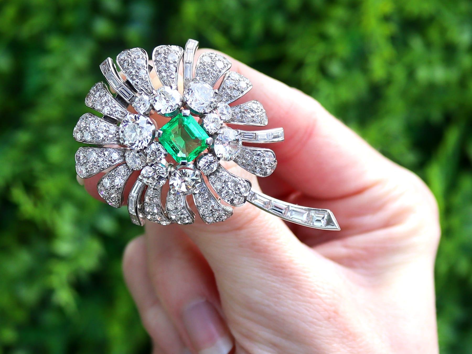 A magnificent, stunning and impressive antique 2.10 carat emerald and 7.73 carat diamond, platinum floral brooch; part of our diverse floral jewelry and estate jewelry collections.

This magnificent, fine and impressive antique emerald and diamond