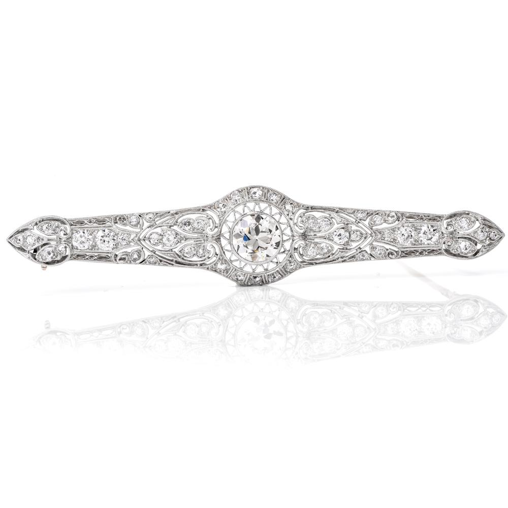 This Antique 1930's diamond  bar brooch of stunning brilliance and aesthetic refinement is crafted in solid platinum  . Center with round diamond approx. 2.15 carats, graded I color and VS clarity. Mounted within an exquisite filigree setting with