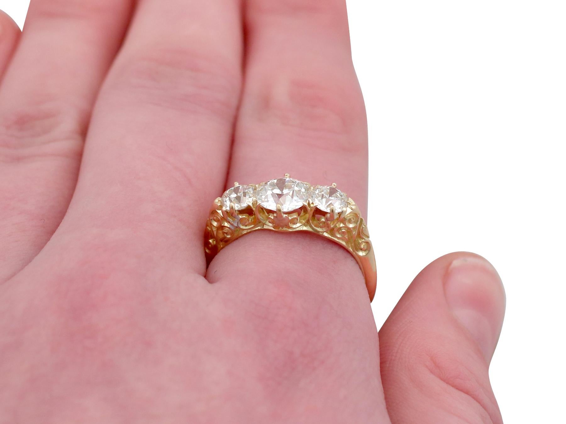 Antique 2.16 Carat Diamond Yellow Gold Three-Stone Ring 4