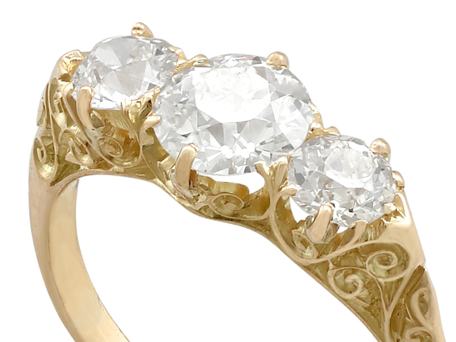 A stunning antique 2.16 carat diamond and 18 carat yellow gold three stone dress ring; part of our diverse antique jewellery and estate jewelry collections.

This stunning, fine and impressive antique three stone ring has been crafted in 18 ct