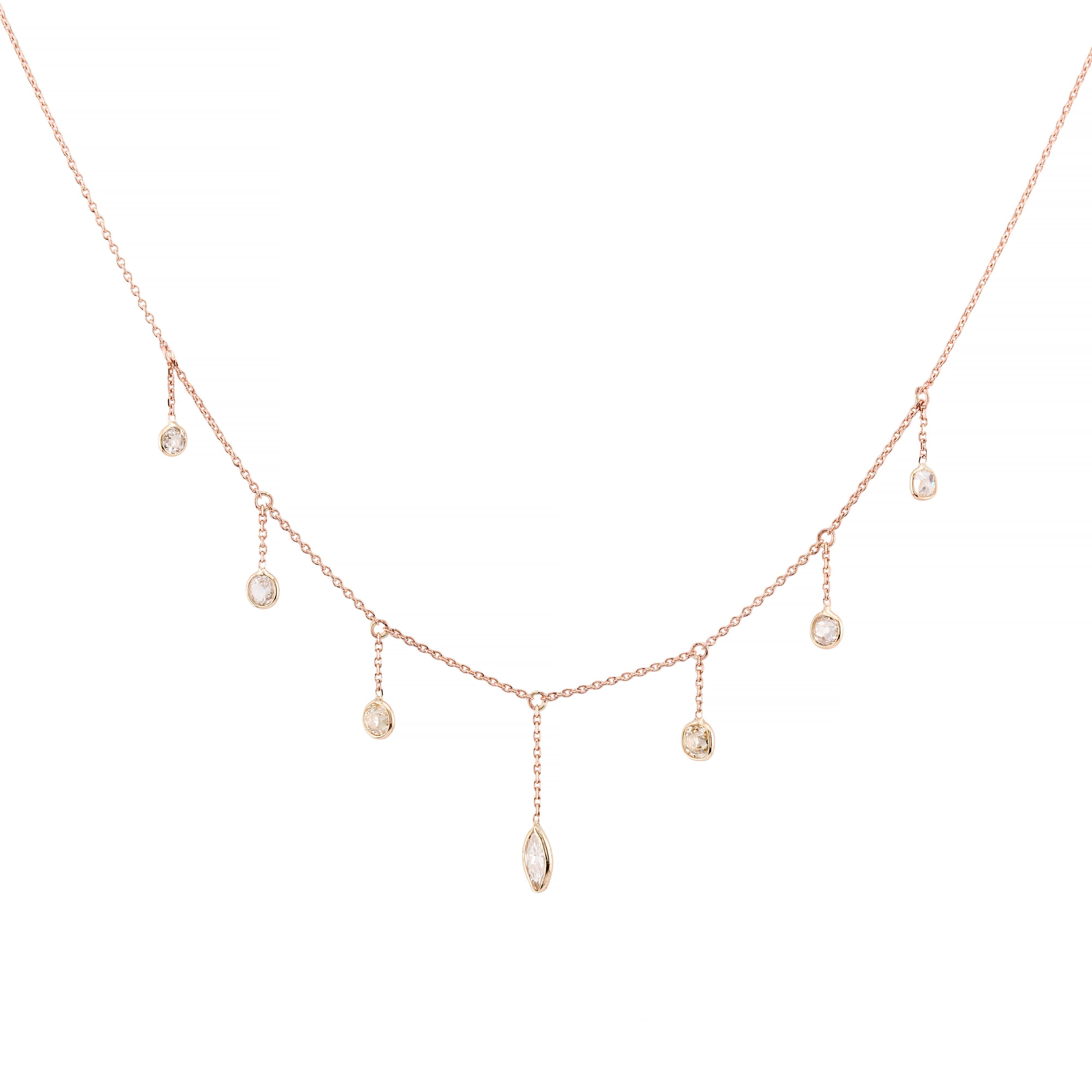 Aston Estate Jewelry Presents:

An antique drop necklace in 14K rose gold, adorned with old mine cut diamonds. The necklace features a series of antique mine and old marquise diamond drops, each set in a bezel, creating a graceful cascade.

The old