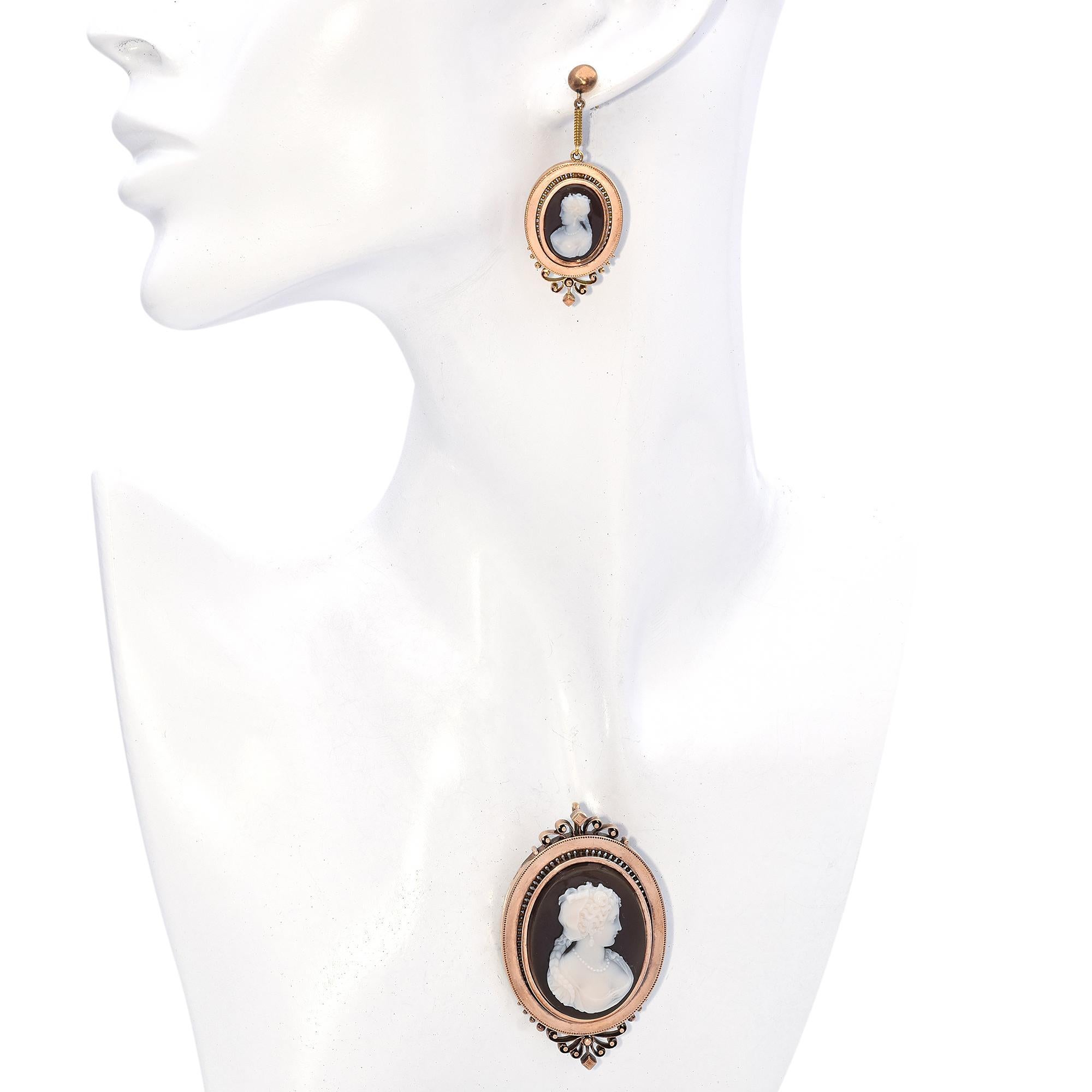 Stone: Agate Cameo
Weight: 32.8 Grams
Brooch/Pendant: 35 x 57.5 mm
Earrings: 19.8 x 50 mm
Metal: Brooch 21k, Earrings Centerpiece 18k, Top Parts and Backs are 14k.

ITEM #: BR-1259-042324-04