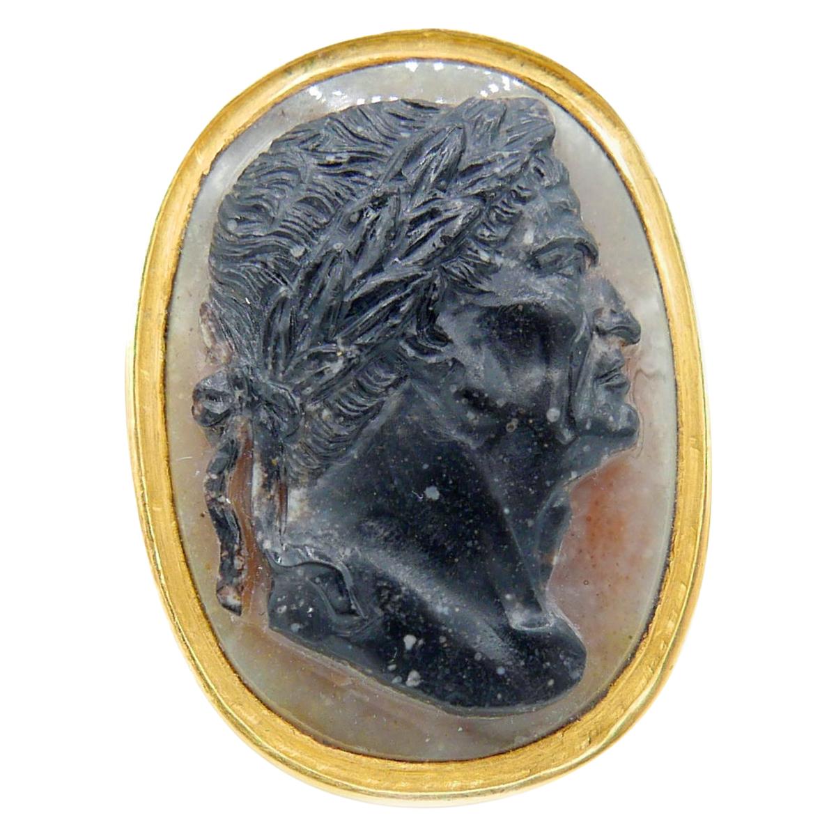 A large carved agate cameo ring depicting the Roman emperor Vespasian (9 - 79 AD). 
The high carat gold mounting is late 19th Century. 
The cameo is Italian, early 18th century. 
The cameo measures 2.5 x 1.8cm
Ring size 9 US - sizable.
Weighs 15