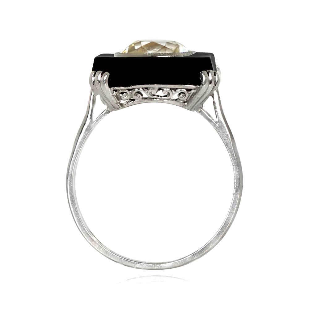 An antique Art Deco ring featuring a 2.25 carat old European cut diamond bezel-set in buffed onyx. The M color and VS2 clarity diamond is held by prongs leading to an openwork under-gallery. Handcrafted in platinum, circa 1920.

Ring Size: 6.5 US,