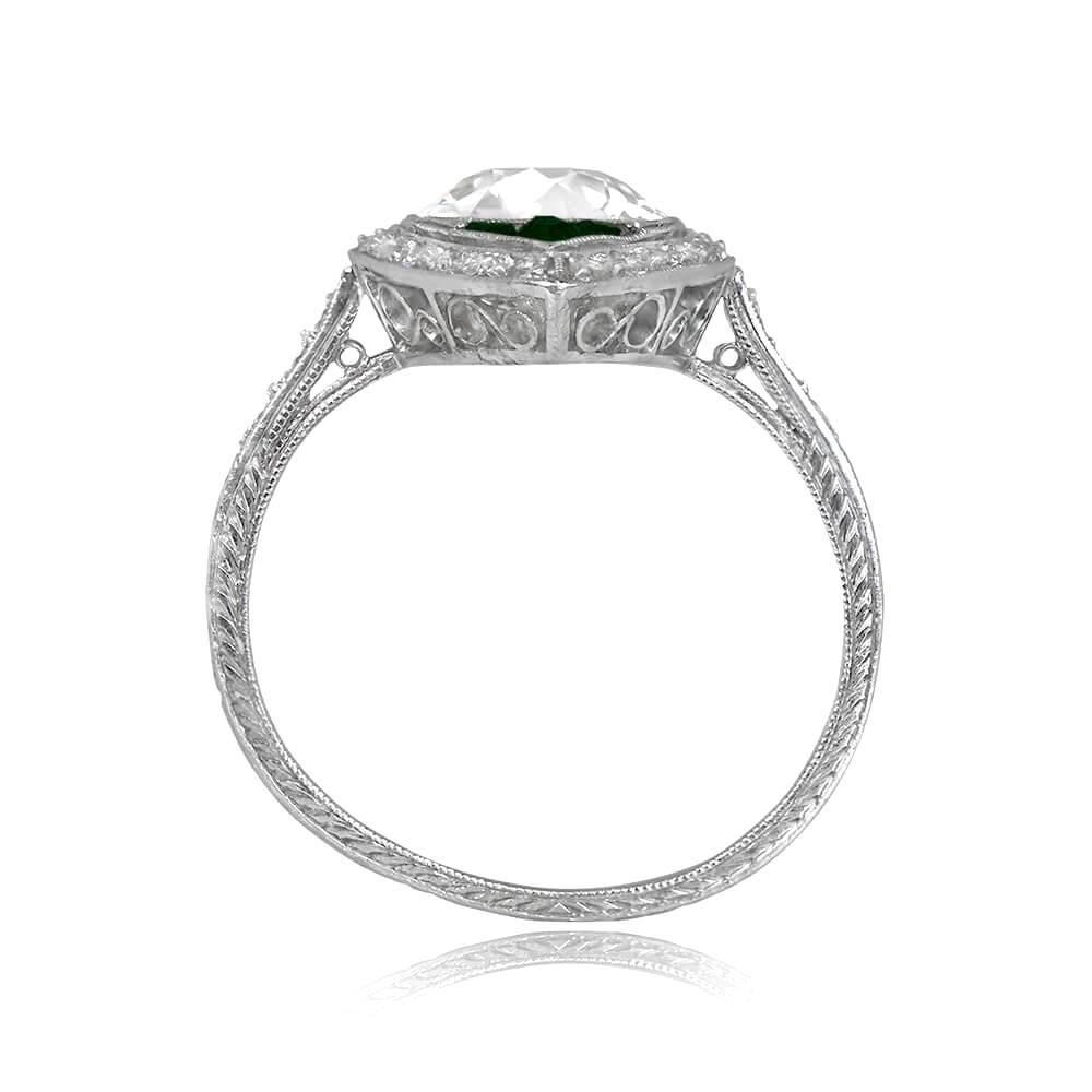 Indulge in the sheer splendor of an extraordinary antique navette ring, transporting you to the enchanting era of Art Deco. A dazzling old European cut diamond, weighing approximately 2.25 carats, takes center stage, radiating its mesmerizing