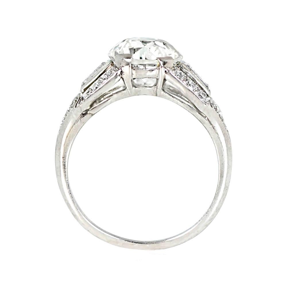 Art Deco engagement ring, 2.26 carat old European cut diamond (J color, VS1 clarity), prong-set. Shoulders feature bezel-set baguette cut diamonds, bordered by old European cut diamonds towards the shank (~0.44 carats). Platinum with fine milgrain.