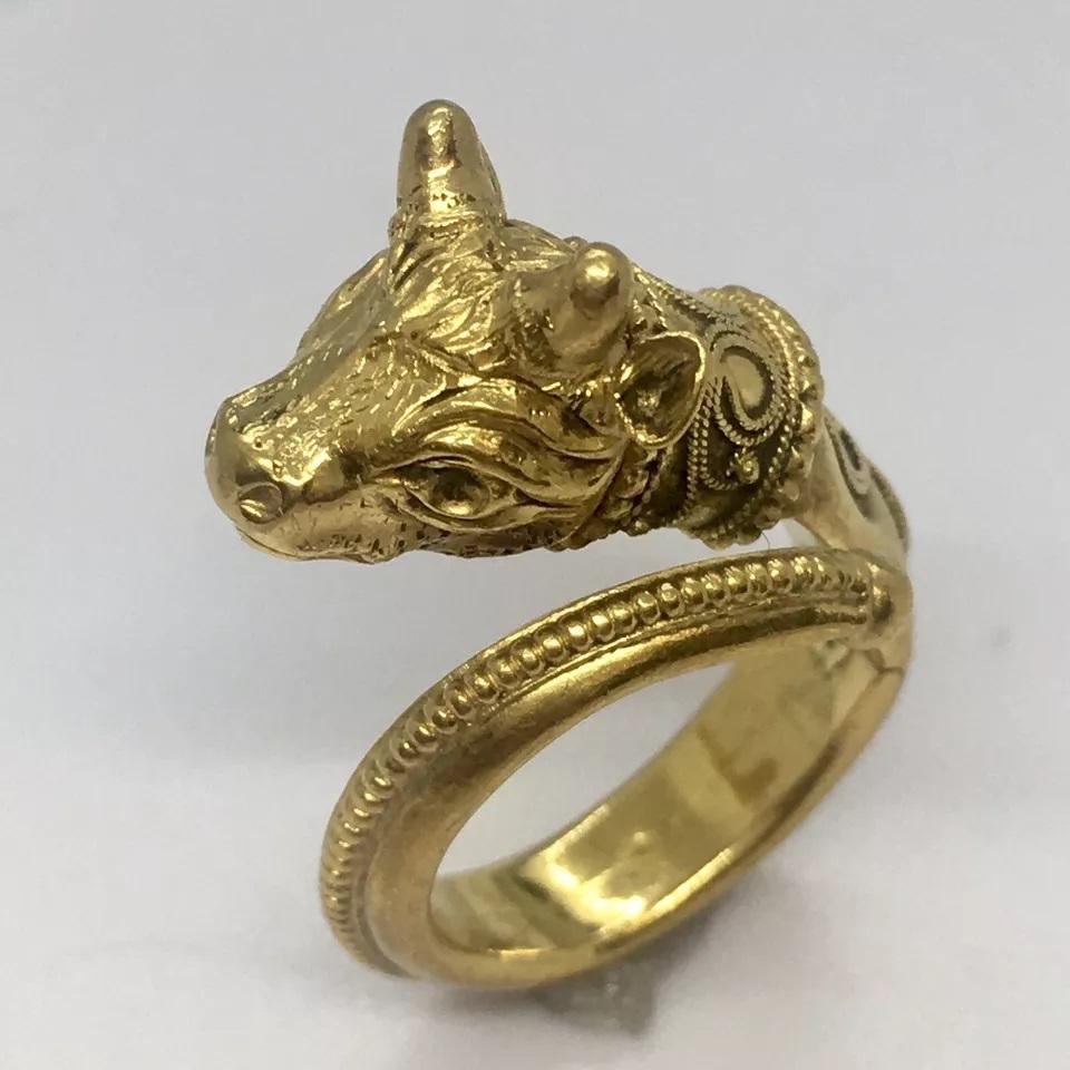 Antique 22K GOLD El Toro Head Ring 7.7 Gram Size 5 Adjustable Granulation Hand Made

This antique 22k gold bull head ring is a stunning piece of jewelry that will add a touch of elegance to any outfit. The ring is handcrafted with intricate