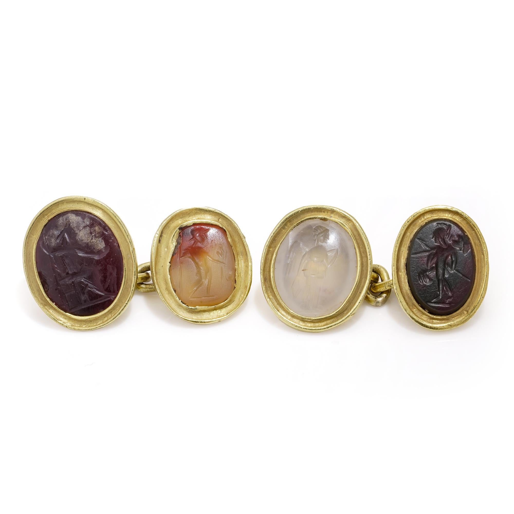 Antique 22kt yellow gold cufflinks, each adorned with Roman 4 carved hardstones, including Chalcedony, banded agate, carnelian, and hematite. Crafted in the 19th century, the intricate carvings depict various figures of a man. The X-ray verified for