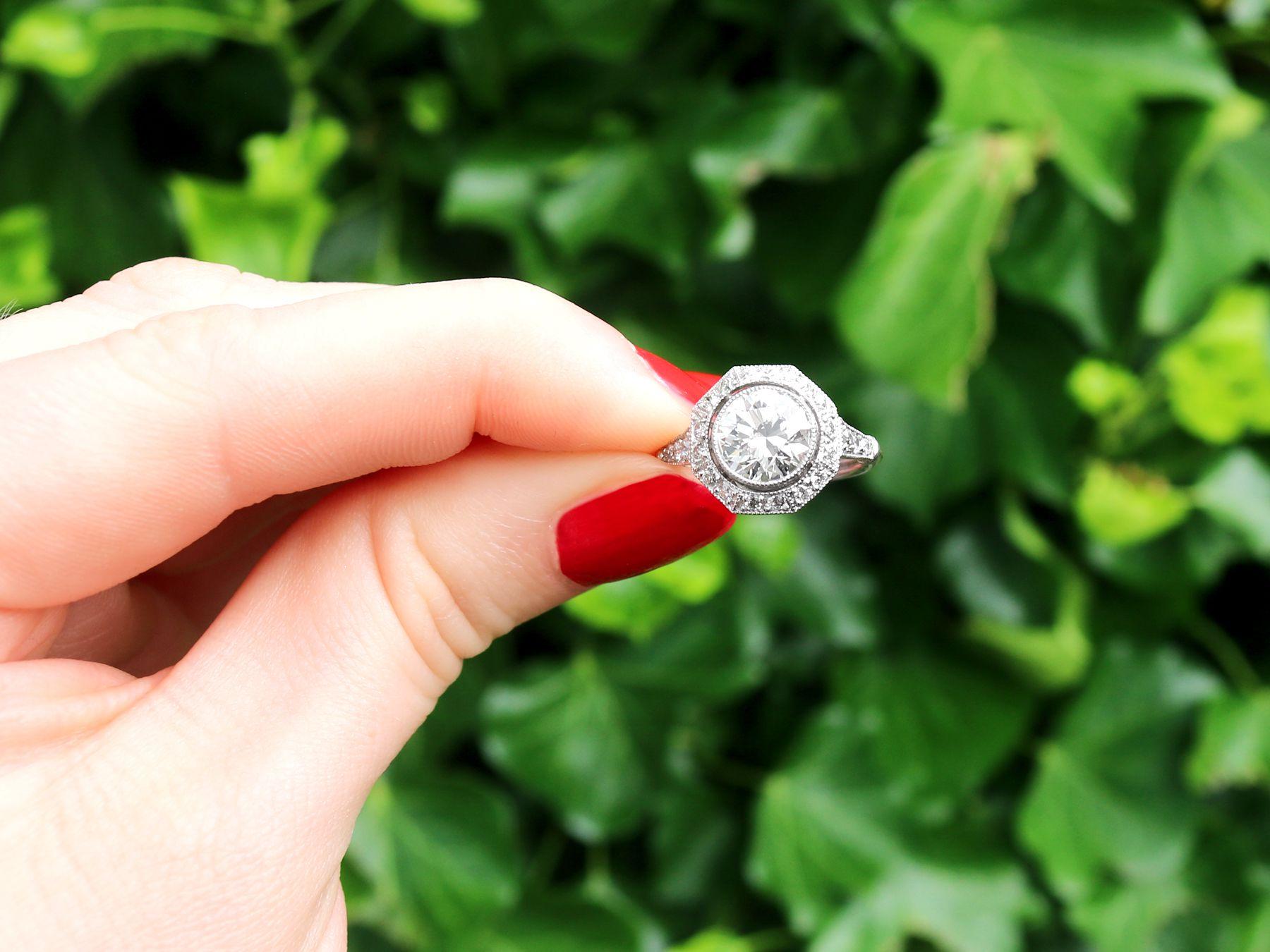 An impressive antique and vintage 2.30 carat diamond and contemporary platinum cocktail ring; part of our diverse diamond jewelry and estate jewelry collections.

This stunning, fine and impressive halo diamond engagement ring has been crafted in