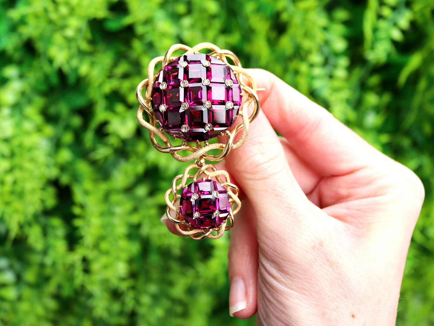 A stunning, fine and impressive antique 23.50 carat garnet, 0.28 carat diamond and 18 karat yellow gold brooch; part of our diverse Victorian jewelry and estate jewelry collections.

This stunning, fine and impressive antique Victorian brooch has