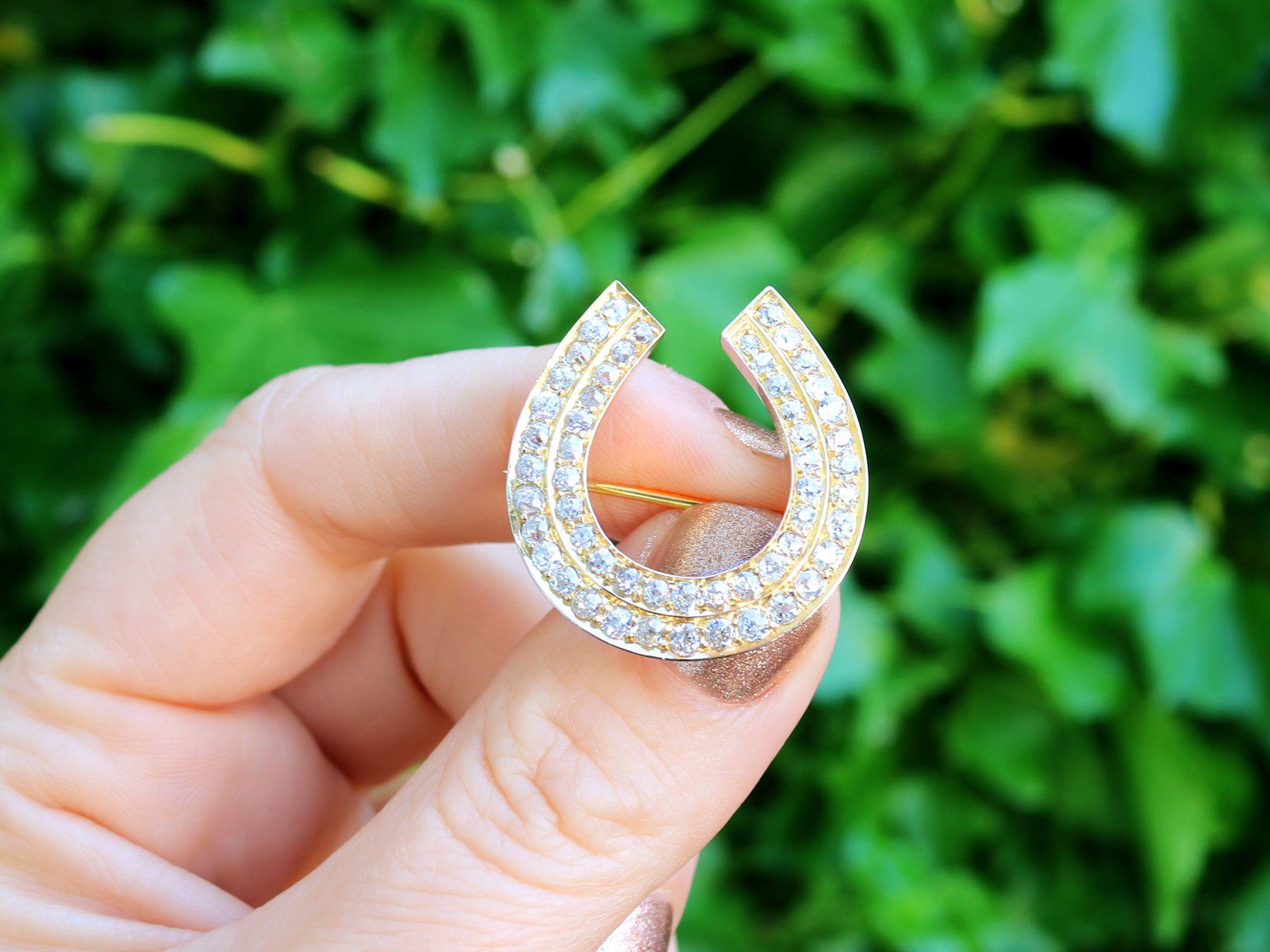 A stunning, fine and impressive antique 2.36 carat diamond and 9 karat yellow gold horseshoe brooch; part of our diverse antique jewelry and estate jewelry collections.

This exceptional, fine and impressive antique brooch has been crafted in 9k