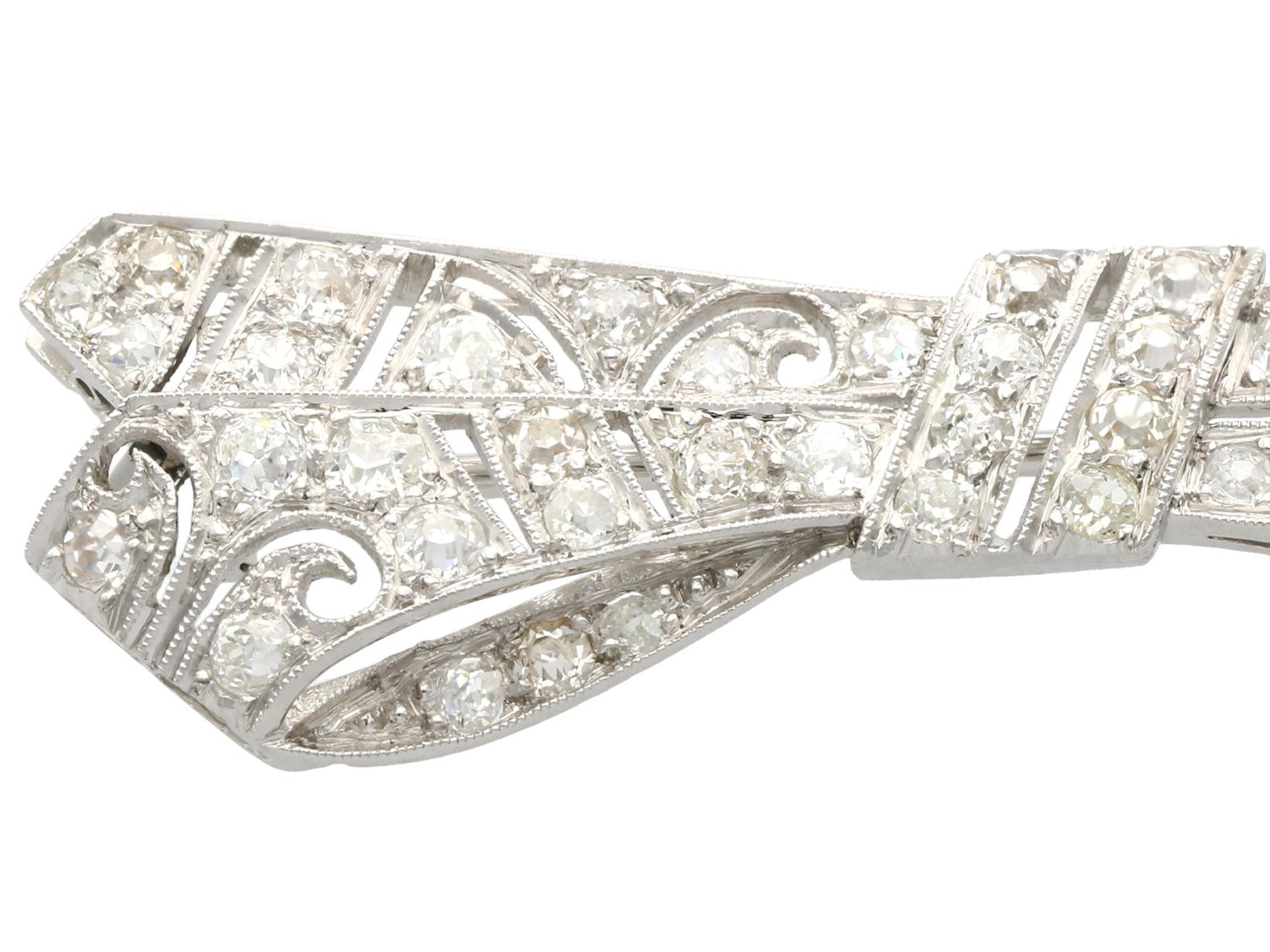 Round Cut Antique 2.36 Carat Diamond and Platinum 'Bow' Brooch