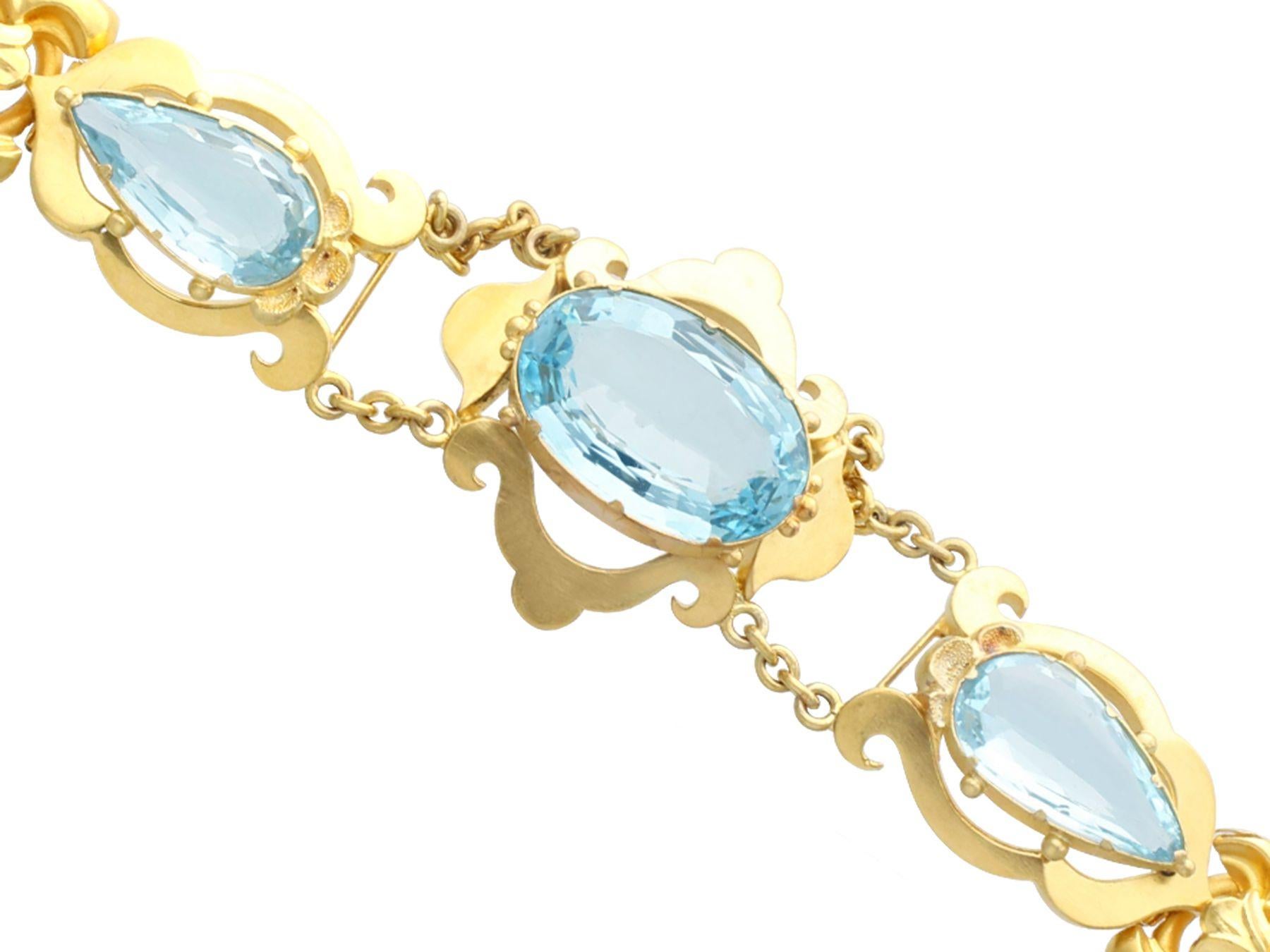 A stunning, fine and impressive antique 23.72 carat aquamarine, 21 karat and 12 karat yellow gold necklace; part of our diverse antique jewelry collections

This stunning, fine and impressive 19th century aquamarine necklace has been crafted in 21k