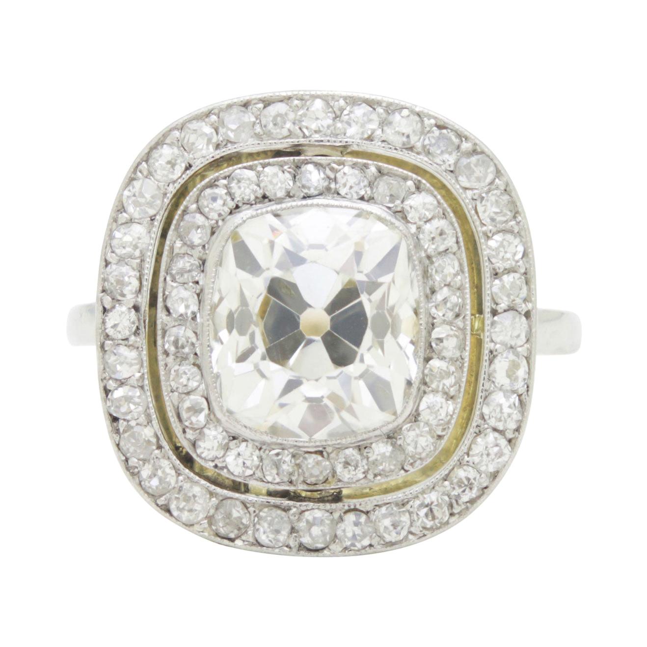 Antique 2.45 Carat Old Mine Cushion Cut Diamond Double Halo Ring For Sale